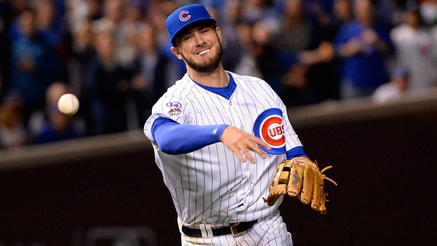 CHICAGO, IL - OCTOBER 20: Kris Bryant #17 of the Chicago Cubs throws to first base during Game 3 of the NLCS against the New York Mets at Wrigley Field on Tuesday, October 20, 2015 in Chicago , Illinois. (Photo by Ron Vesely/MLB Photos via Getty Images)