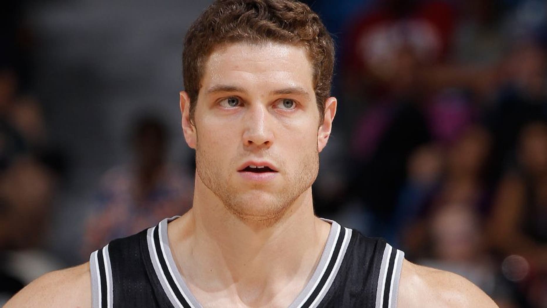SACRAMENTO, CA - OCTOBER 8: Jimmer Fredette #16 of the San Antonio Spurs looks on during the game against the Sacramento Kings on October 8, 2015 at Sleep Train Arena in Sacramento, California. NOTE TO USER: User expressly acknowledges and agrees that, by downloading and or using this photograph, User is consenting to the terms and conditions of the Getty Images Agreement. Mandatory Copyright Notice: Copyright 2015 NBAE (Photo by Rocky Widner/NBAE via Getty Images)