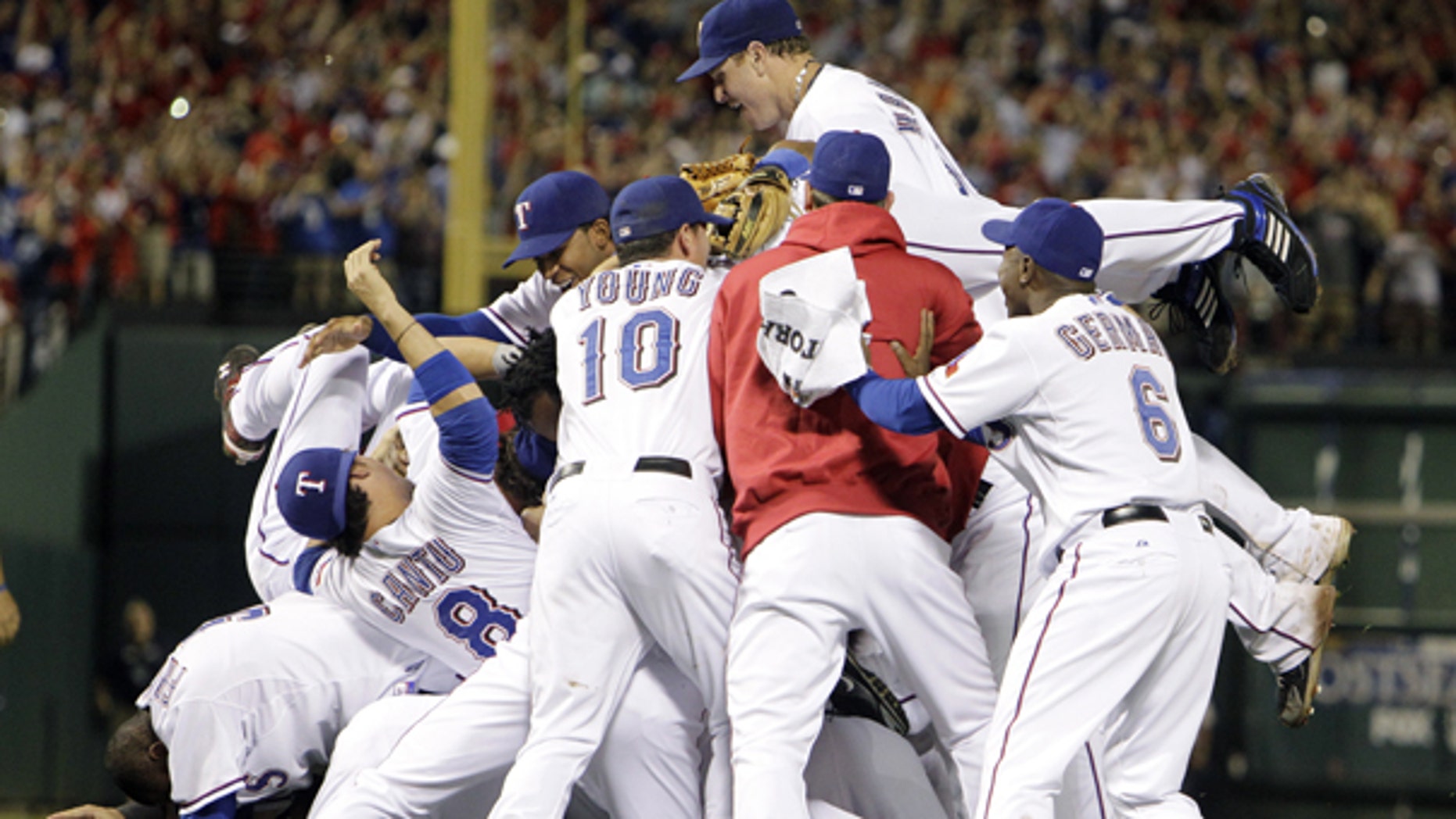 Oct. 22: Texas Rangers players celebrate after a 6-1 over the New York Yankees win in the deciding Game 6 of baseball's American League Championship Series in Arlington, Texas.