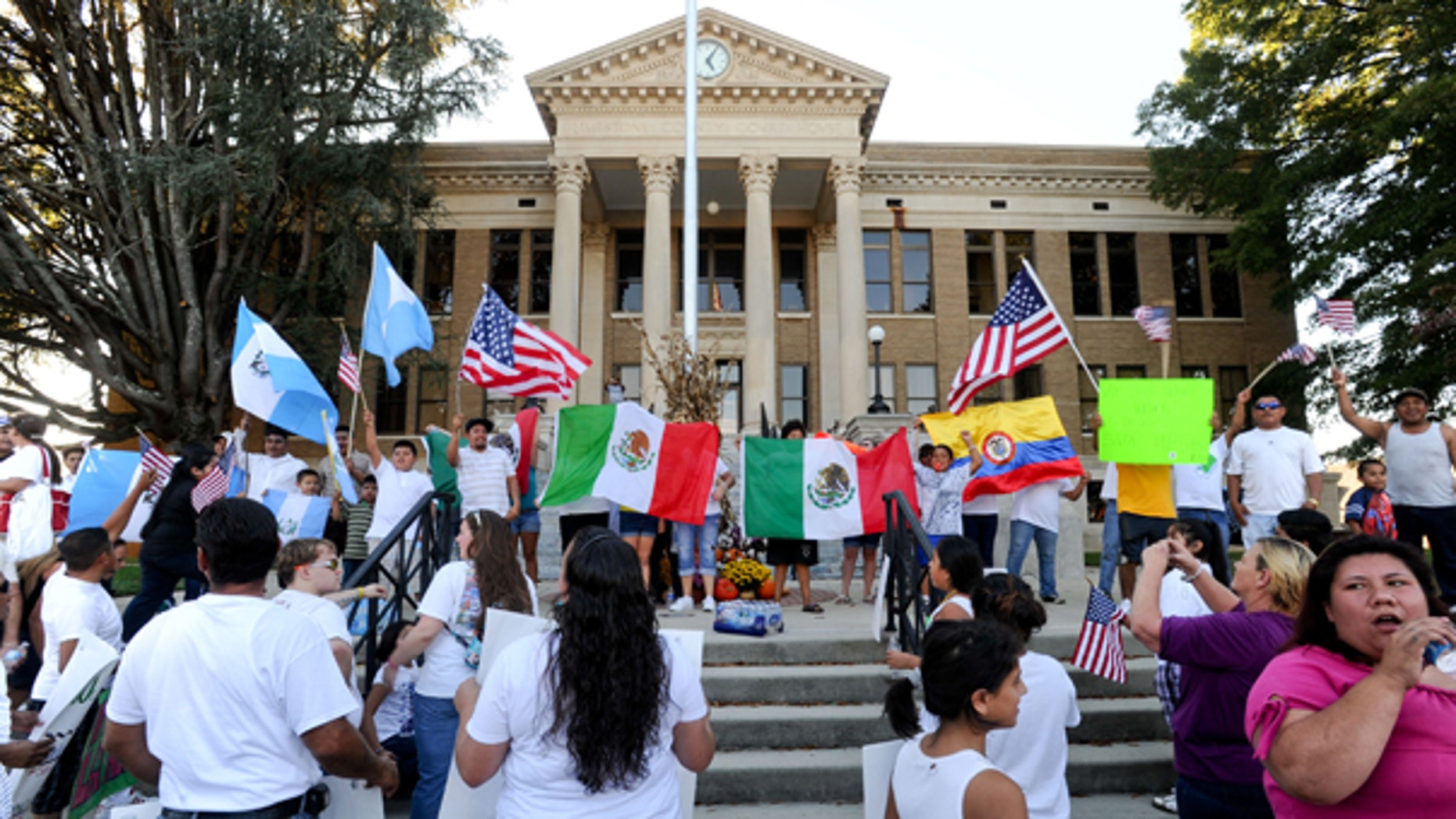 Oct. 16, 2011: Marchers gather on the steps of the Limestone County Courthouse to protest Alabama's immigration law in Athens, Ala.
