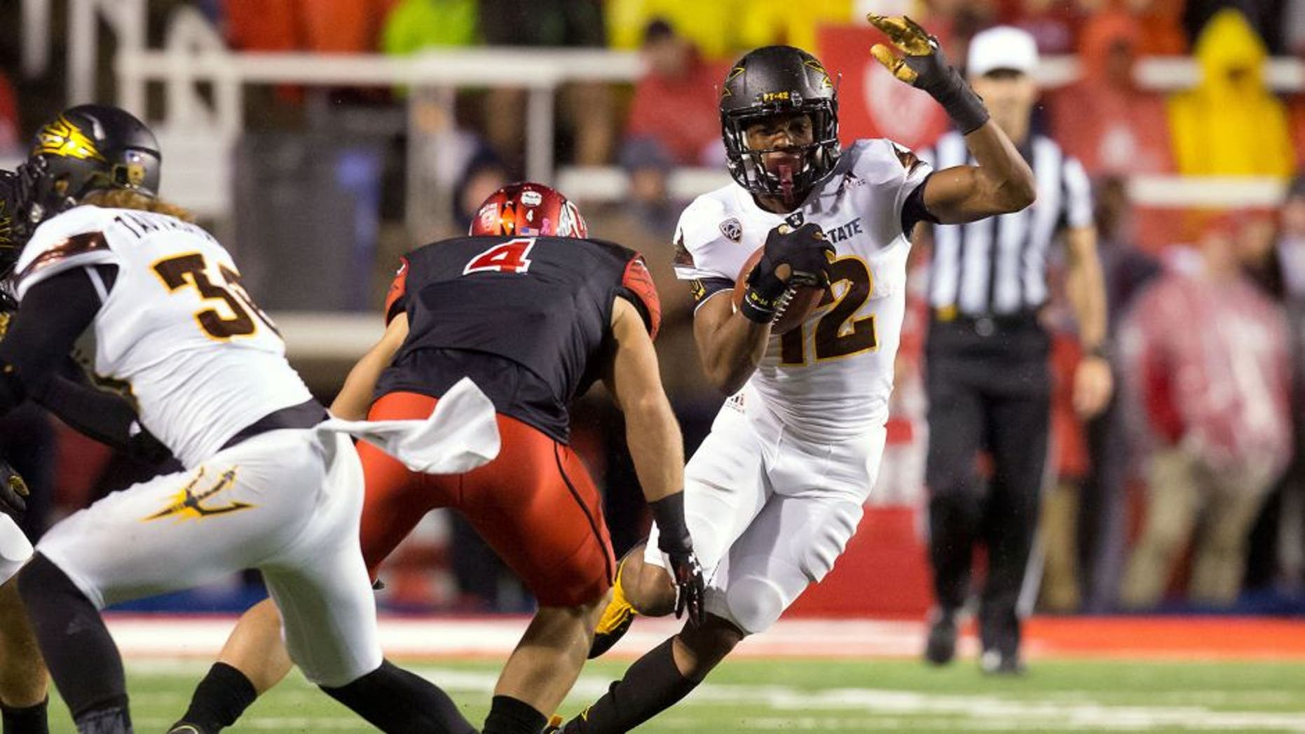 Oct 17, 2015; Salt Lake City, UT, USA; Arizona State Sun Devils wide receiver Tim White (12) runs after receiving a kickoff as Utah Utes defender Austin Lee (4) moves in for the tackle during the second half at Rice-Eccles Stadium. Utah won 34-18. Mandatory Credit: Russ Isabella-USA TODAY Sports