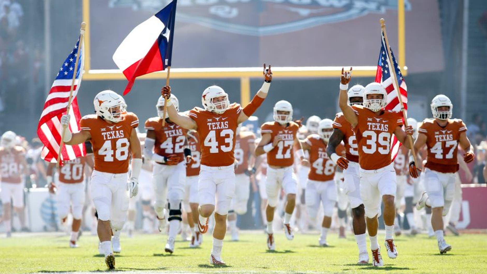 Oct 10, 2015; Dallas, TX, USA; Texas Longhorns players takes the field before the game against the Oklahoma Sooners at the Red River rivalry at Cotton Bowl Stadium. Texas won 24-17. Mandatory Credit: Tim Heitman-USA TODAY Sports