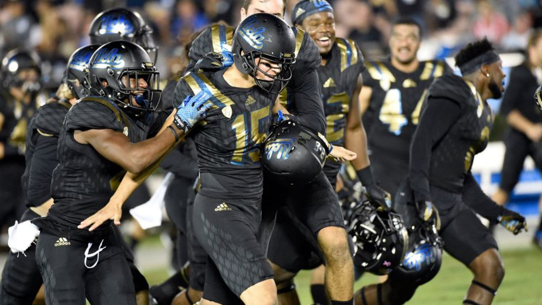 Oct 22, 2015; Pasadena, CA, USA; UCLA Bruins place kicker Ka'imi Fairbairn (15) celebrates making a sixty-yard field goal against the California Golden Bears during the second quarter at Rose Bowl. Mandatory Credit: Richard Mackson-USA TODAY Sports