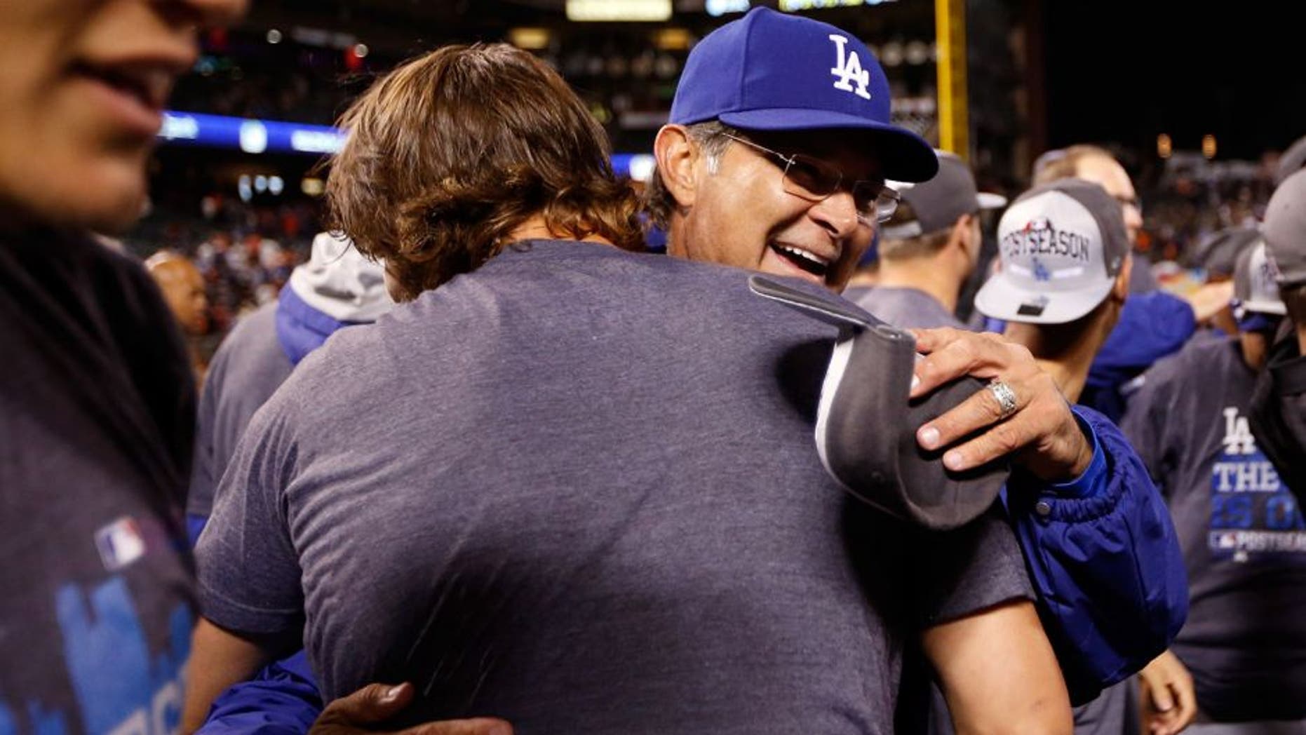 SAN FRANCISCO, CA - SEPTEMBER 29: Manager Don Mattingly hugs Clayton Kershaw #22 of the Los Angeles Dodgers after they beat the San Francisco Giants to clinch the National League West title at AT&T Park on September 29, 2015 in San Francisco, California. (Photo by Ezra Shaw/Getty Images)