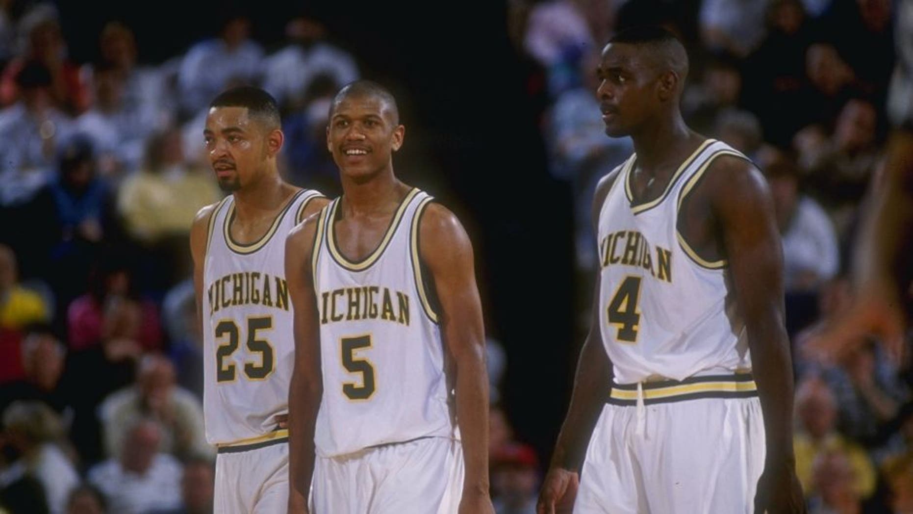 8 Mar 1992: Michigan Wolverines forward Juwan Howard, guard Jalen Rose, and forward Chris Webber (l to r) look on during a game against the Indiana Pacers.
