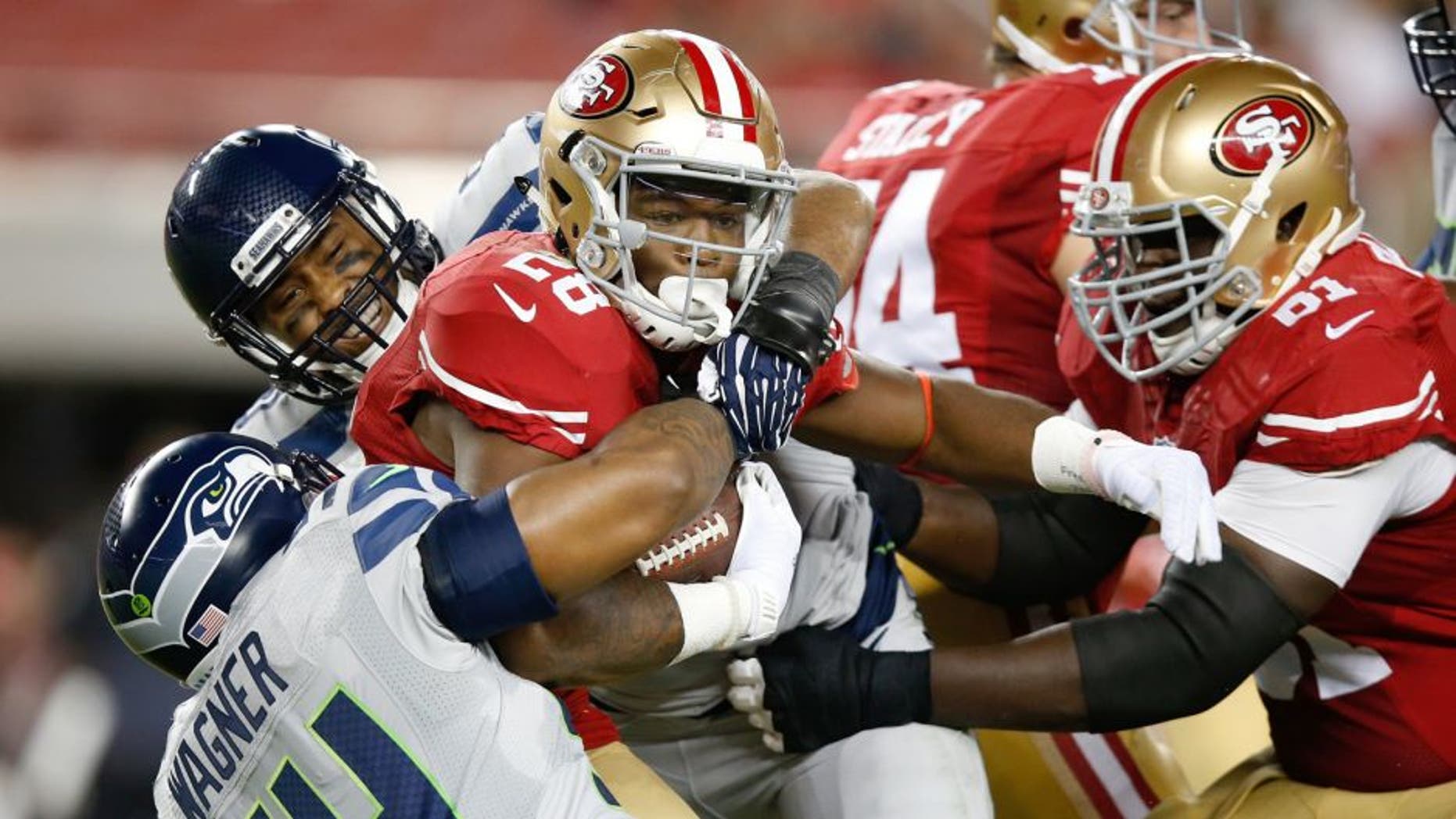 SANTA CLARA, CA - OCTOBER 22: Carlos Hyde #28 of the San Francisco 49ers rushes with the ball against the Seattle Seahawks during their NFL game at Levi's Stadium on October 22, 2015 in Santa Clara, California. (Photo by Ezra Shaw/Getty Images)