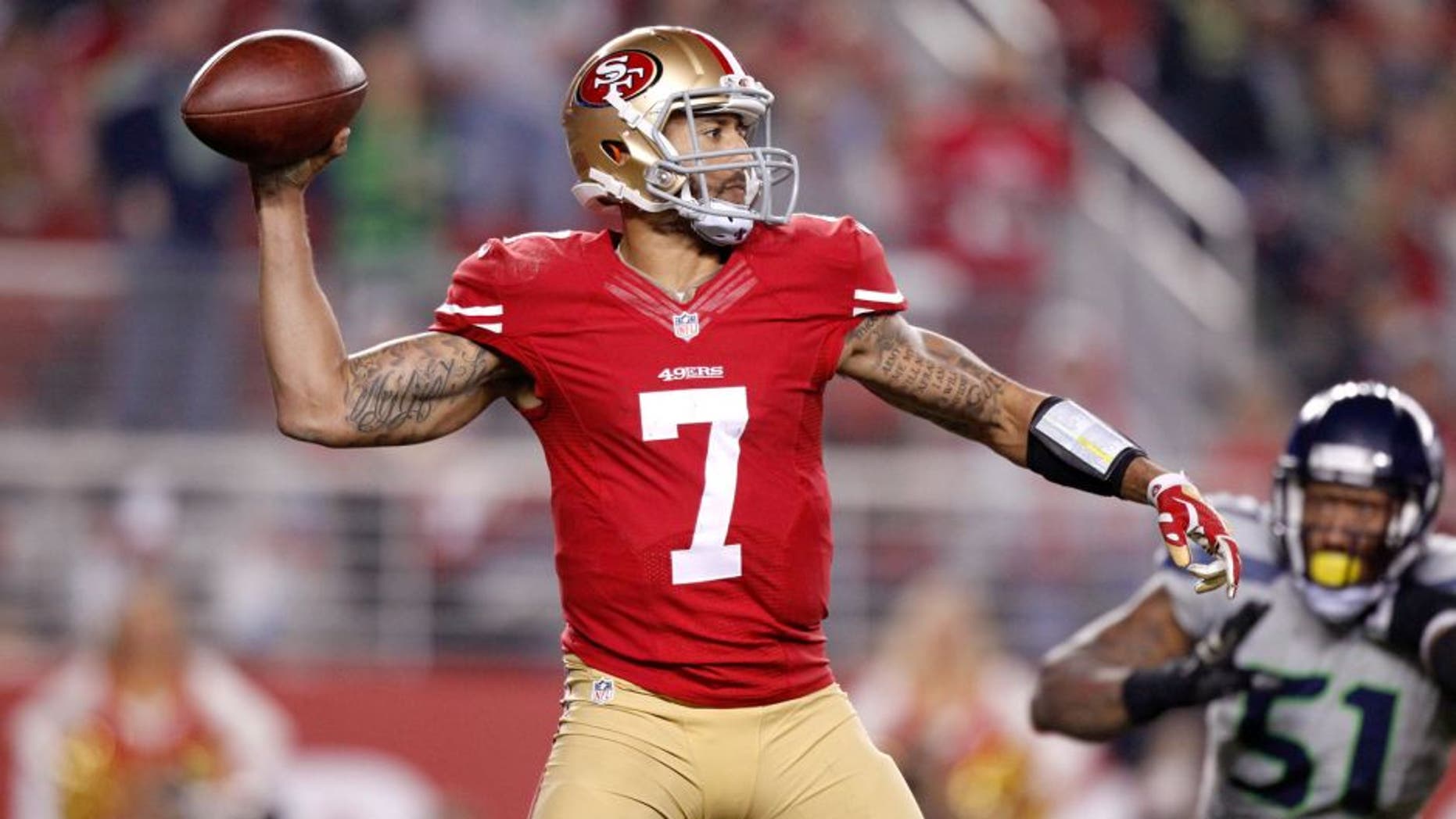 Nov 27, 2014; Santa Clara, CA, USA; San Francisco 49ers quarterback Colin Kaepernick (7) prepares to throw a pass against the Seattle Seahawks in the fourth quarter at Levi's Stadium. The Seahawks defeated the 49ers 19-3. Mandatory Credit: Cary Edmondson-USA TODAY Sports