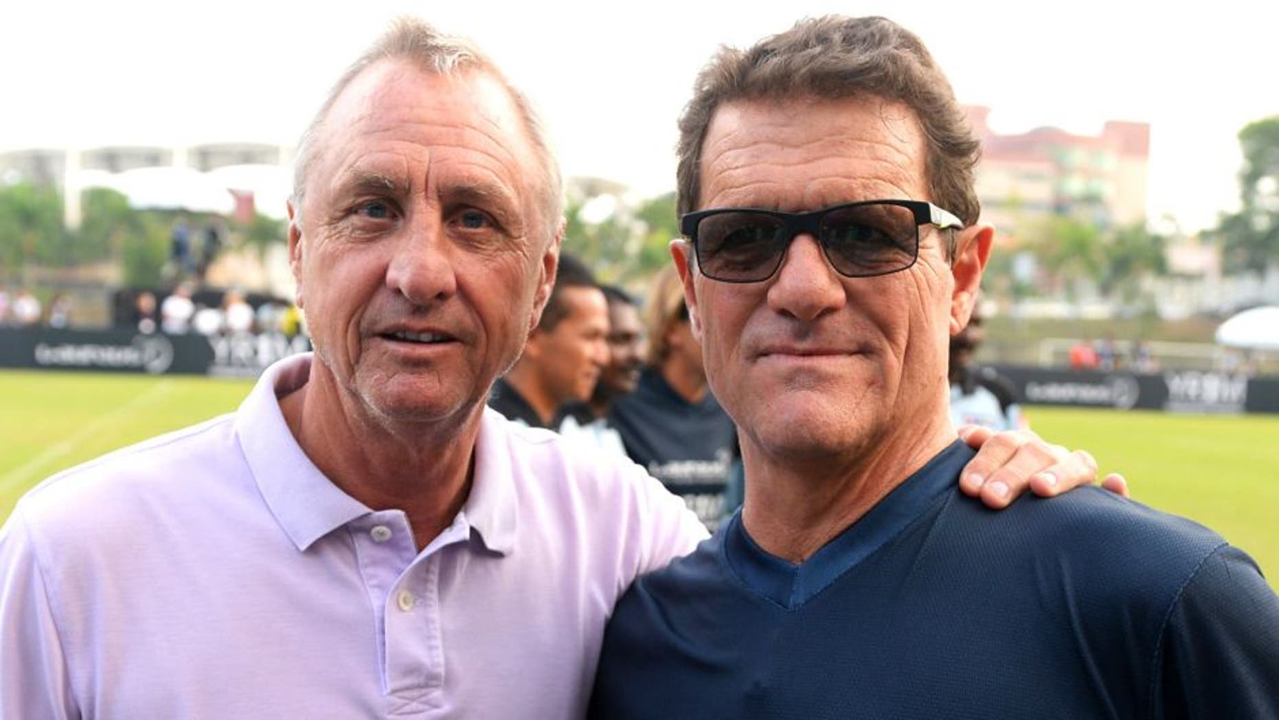 KUALA LUMPUR, MALAYSIA - MARCH 25: Johan Cruyff coach of Team YR1M and Fabio Capello coach of Team Laureus pose during the Laureus All Stars Unity Cup ahead of the 2014 Laureus World Sports Awards at Royal Selangor Club on March 25, 2014 in Kuala Lumpur, Malaysia. (Photo by Mike Hewitt/Getty Images for Laureus)