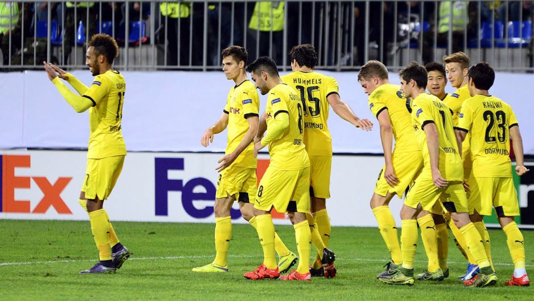 Dortmund's players celebrate a goal during the UEFA Europa League group C football match between Qabala FK and Borussia Dortmund in Baku on October 22, 2015. AFP PHOTO / TOFIK BABAYEV (Photo credit should read TOFIK BABAYEV/AFP/Getty Images)