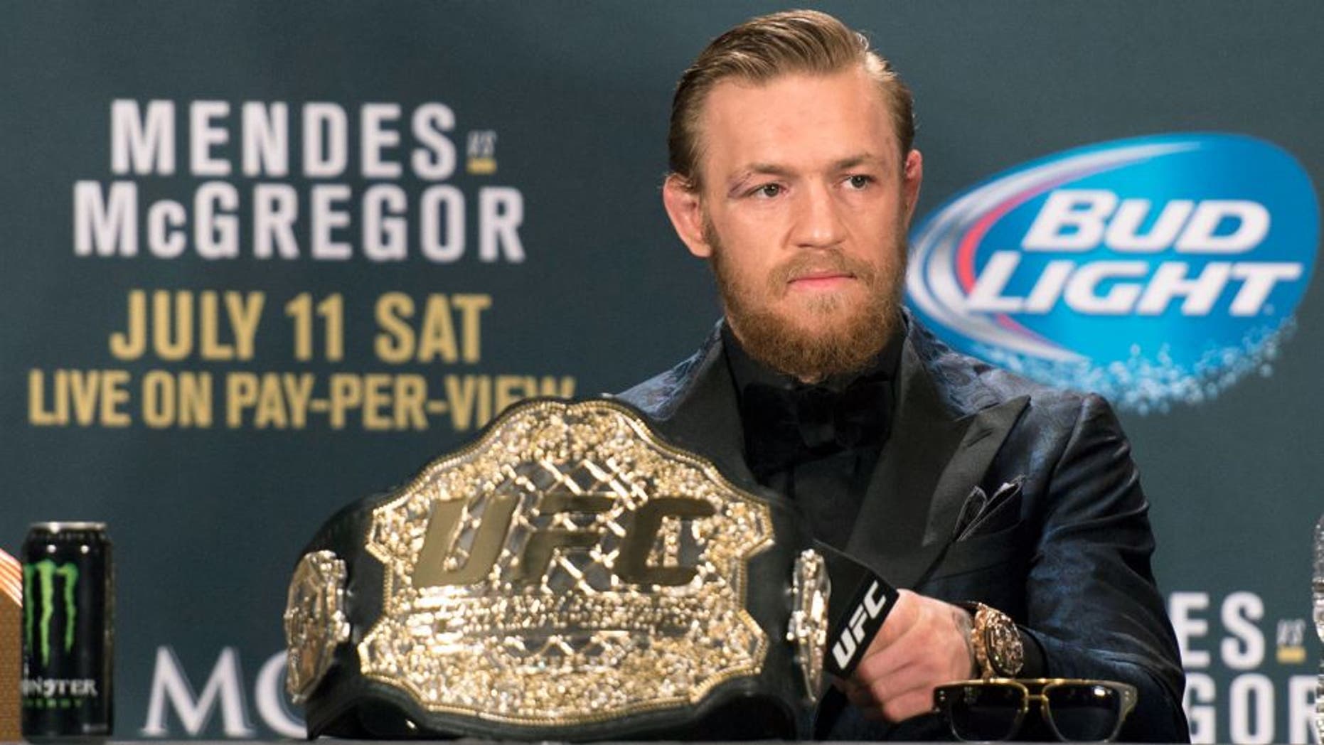 LAS VEGAS, NV - JULY 11: UFC interim featherweight champion Conor McGregor interacts with the media during the UFC 189 post fight press conference at the MGM Grand Garden Arena on July 11, 2015 in Las Vegas, Nevada. (Photo by Jeff Bottari/Zuffa LLC/Zuffa LLC via Getty Images)