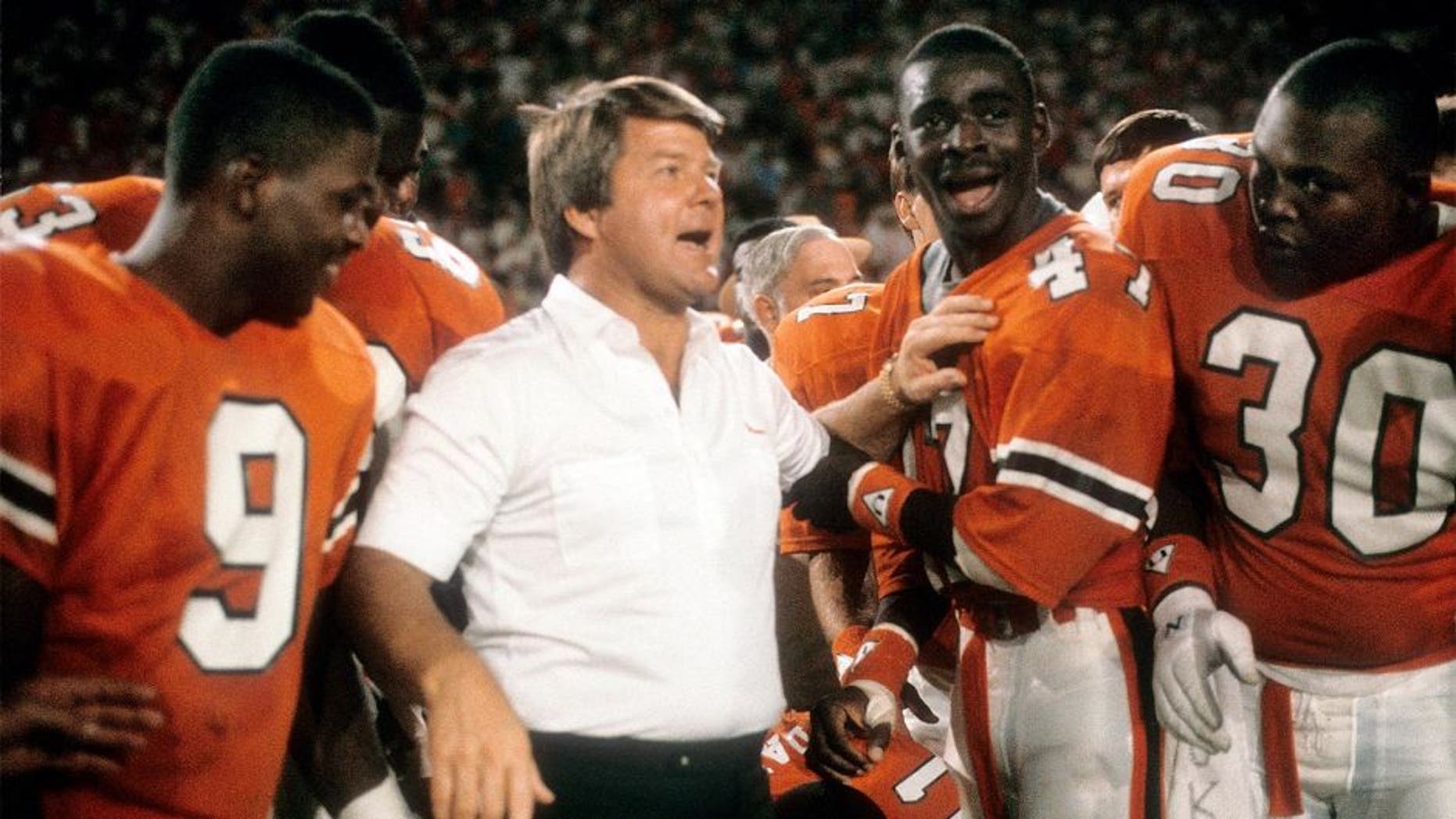 MIAMI, FL - JANUARY 1: Head coach Jimmy Johnson of the #2 rank University of Miami Hurricanes football team with his arm on wide receiver Michael Irvin #47 January 1, 1988 after the NCAA Orange Bowl football Game against the #1 rank Oklahoma University Sooner at the Orange Bowl in Miami, Florida. The Hurricanes won the game 20-14 and became the National Champions. Johnson was the head coach of the Miami Hurricanes from 1984-88. (Photo by Focus on Sport/Getty Images)