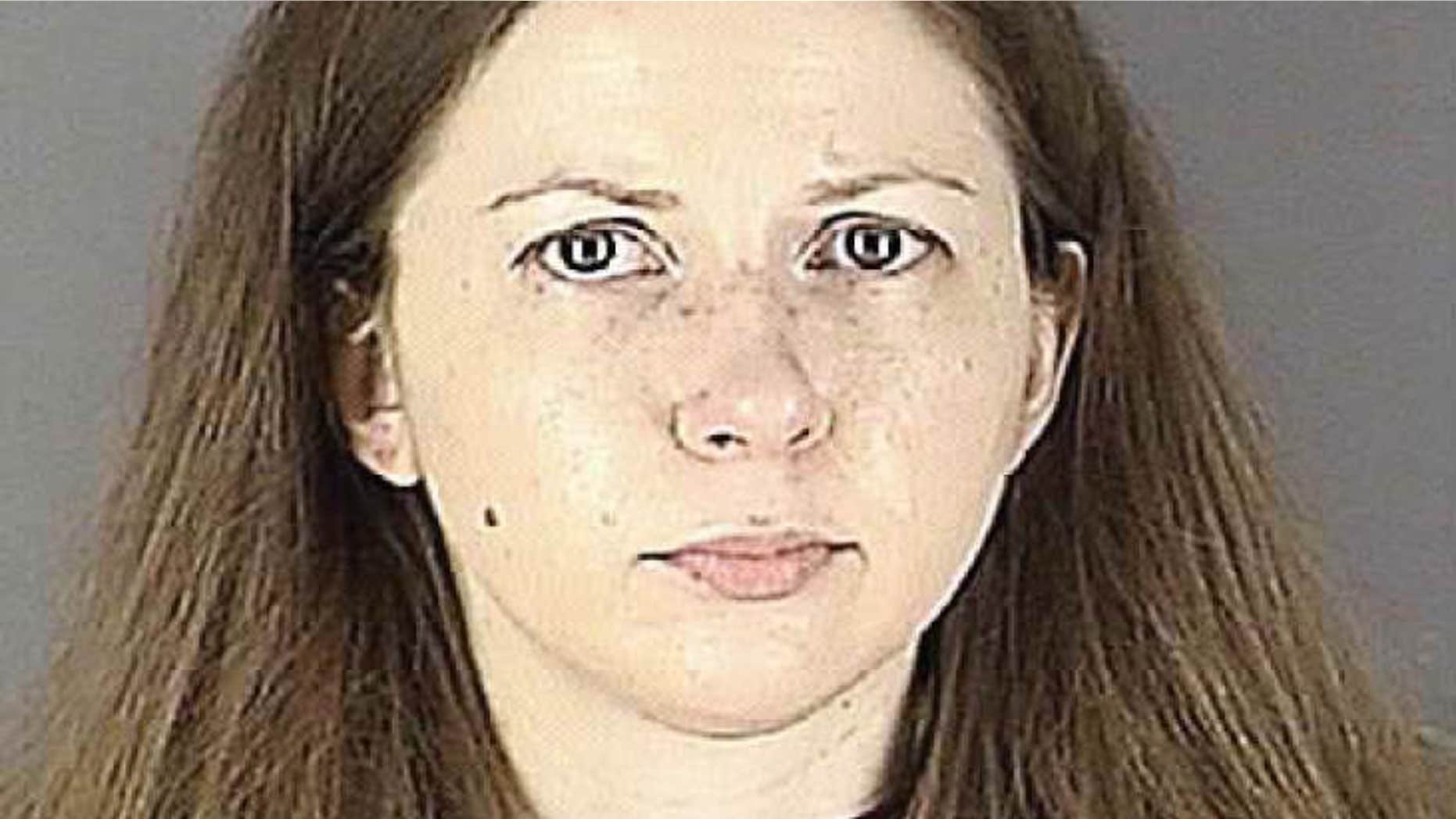 This undated photo provided by the Hennepin County Jail, shows a booking mug of Carrie Pernula.