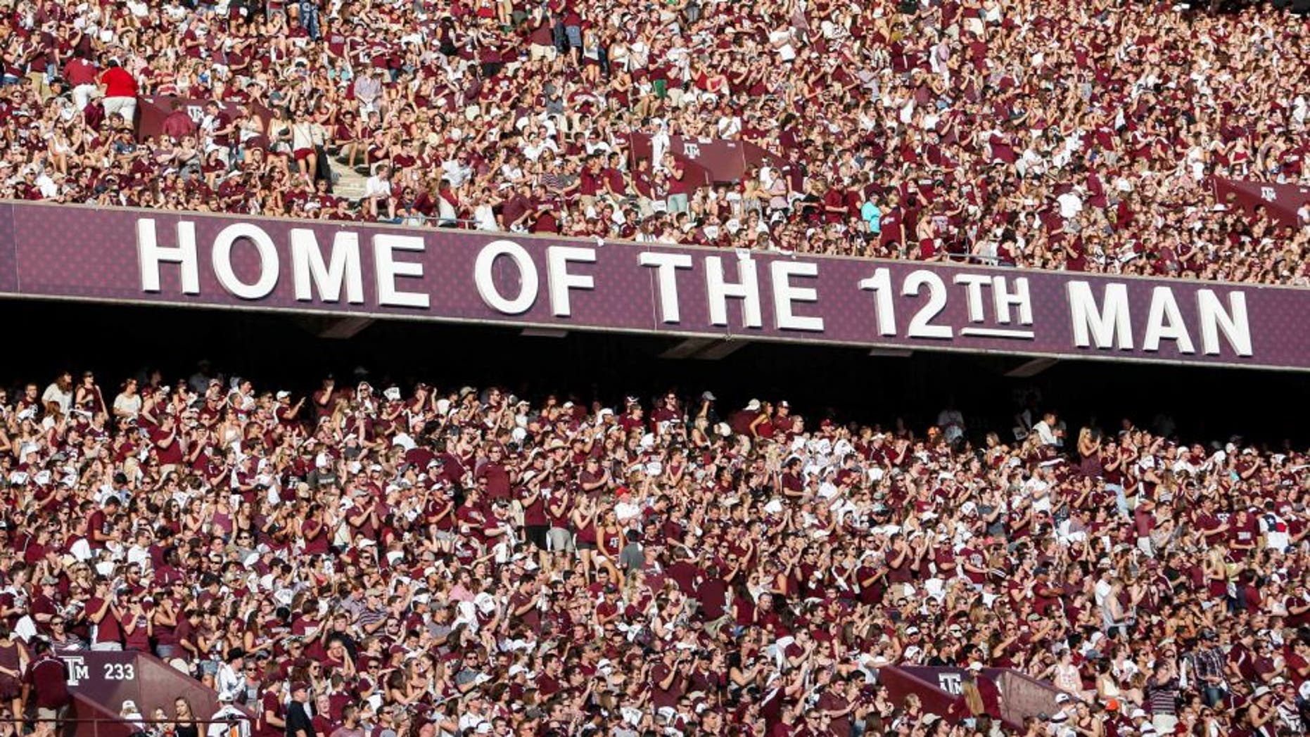 Sep 6, 2014; College Station, TX, USA; Fans cheer before the start of a game between the Texas A&M Aggies and the Lamar Cardinals at Kyle Field. Mandatory Credit: Troy Taormina-USA TODAY Sports