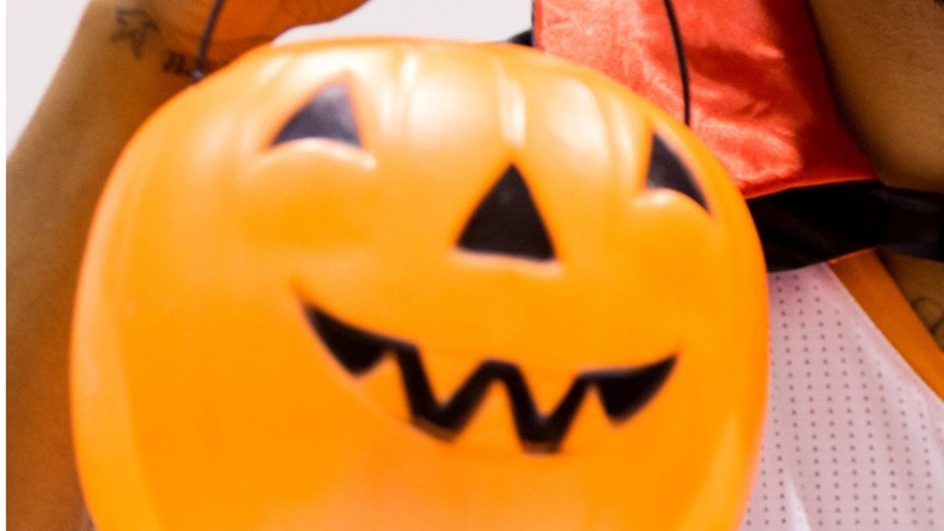 Sep 30, 2013; Phoenix, AZ, USA; Phoenix Suns forward Markieff Morris poses for a portrait wearing Dracula fangs and cape while holding a Halloween pumpkin during media day at US Airways Center. Mandatory Credit: Mark J. Rebilas-USA TODAY Sports