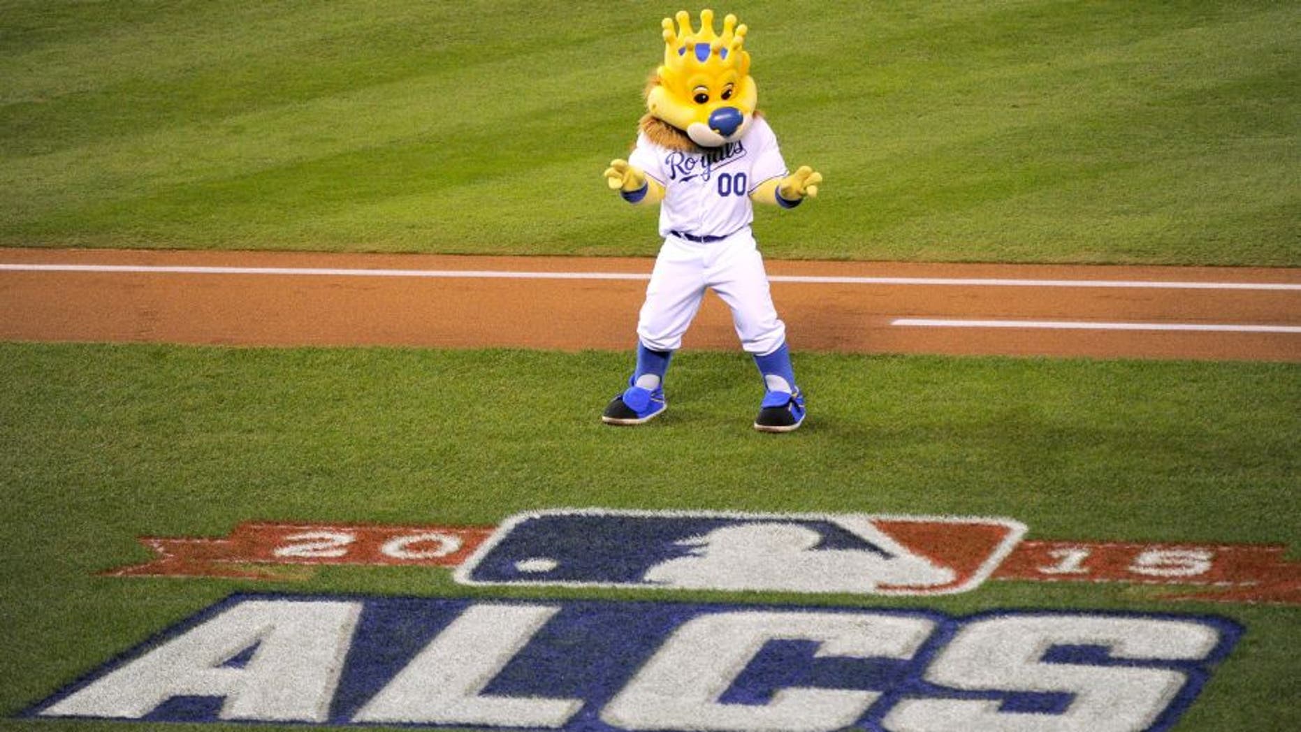 KANSAS CITY, MO - OCTOBER 23: Mascot Sluggerrr performs for the crowd before game six of the 2015 MLB American League Championship Series between the Kansas City Royals and the Toronto Blue Jays at Kauffman Stadium on October 23, 2015 in Kansas City, Missouri. (Photo by Ed Zurga/Getty Images)
