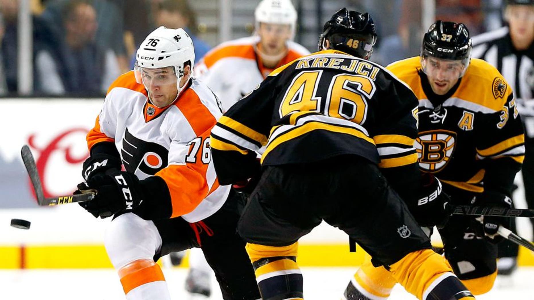 Oct 21, 2015; Boston, MA, USA; Philadelphia Flyers center Chris VandeVelde (76) tries to get past Boston Bruins center David Krejci (46) during the second period of the Philadelphia Flyers 5-4 overtime win over the Boston Bruins at TD Garden. Mandatory Credit: Winslow Townson-USA TODAY Sports