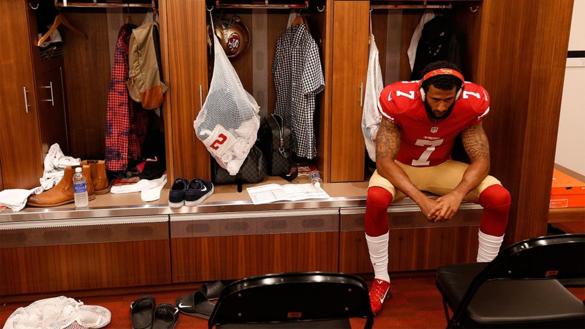 SANTA CLARA, CA - OCTOBER 4: Colin Kaepernick #7 of the San Francisco 49ers listens to music alone in the lcoker room prior to the game against the Green Bay Packers at Levi Stadium on October 4, 2015 in Santa Clara, California. The Packers defeated the 49ers 17-3. (Photo by Michael Zagaris/San Francisco 49ers/Getty Images)