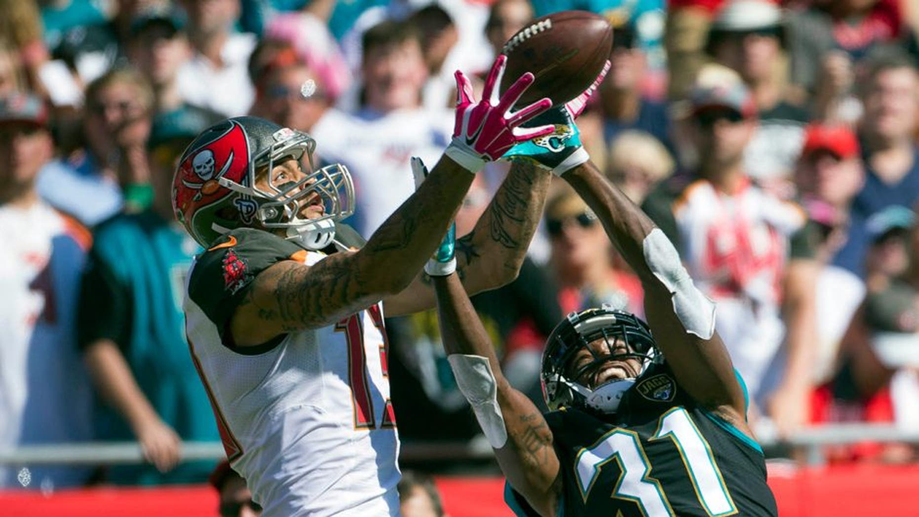 Oct 11, 2015; Tampa, FL, USA; Jacksonville Jaguars cornerback Davon House (31) breaks up a pass intended for Tampa Bay Buccaneers wide receiver Mike Evans (13) in the third quarter at Raymond James Stadium. The Tampa Bay Buccaneers won 38-31. Mandatory Credit: Logan Bowles-USA TODAY Sports