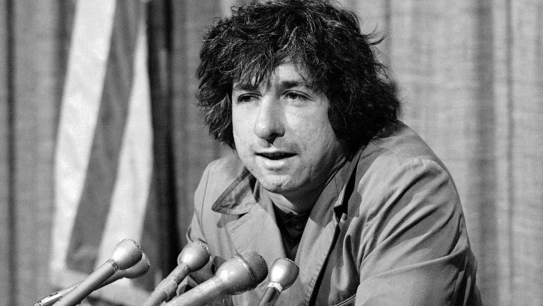 FILE - In this Dec. 6, 1973 file photo, political activist Tom Hayden, husband of Jane Fonda, tells newsmen in Los Angeles that he believes public support was partially responsible for the decision not to send him and others of the Chicago 7 to jail for contempt.