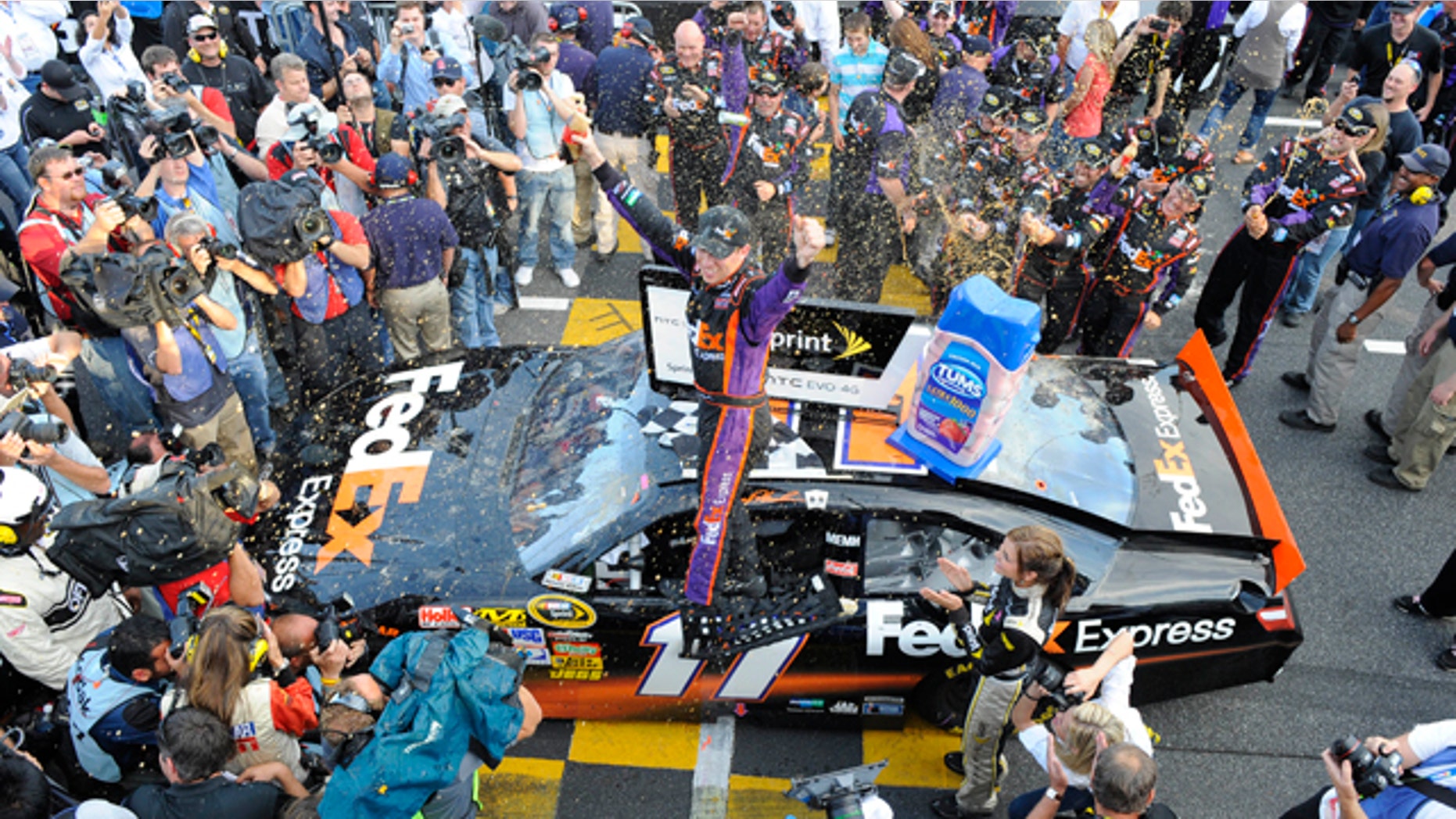 Oct. 24: Denny Hamlin celebrates after winning the NASCAR Sprint Cup Series auto race at Martinsville Speedway in Martinsville, Va.