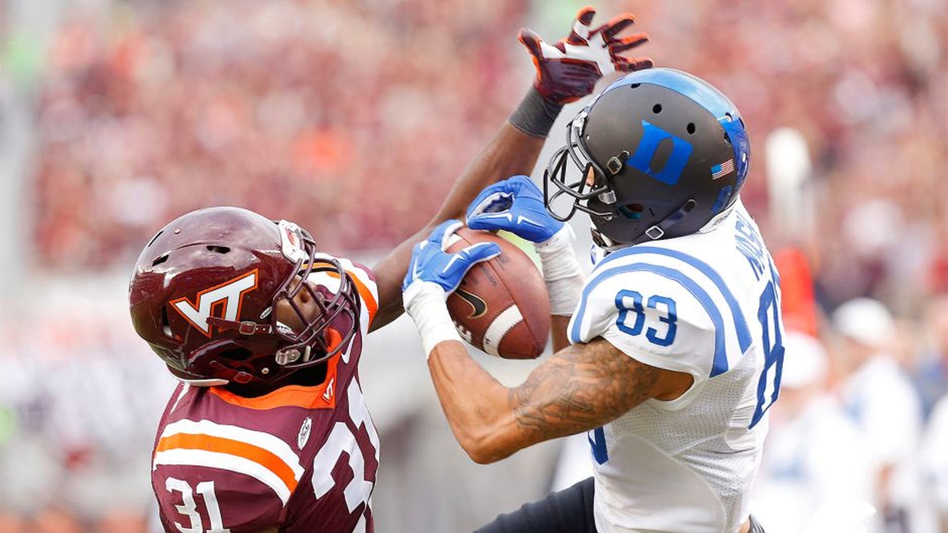 Oct 24, 2015; Blacksburg, VA, USA; Duke Blue Devils wide receiver Anthony Nash (83) attempts to catch the ball as Virginia Tech Hokies cornerback Brandon Facyson (31) defends in the second quarter at Lane Stadium. Mandatory Credit: Geoff Burke-USA TODAY Sports