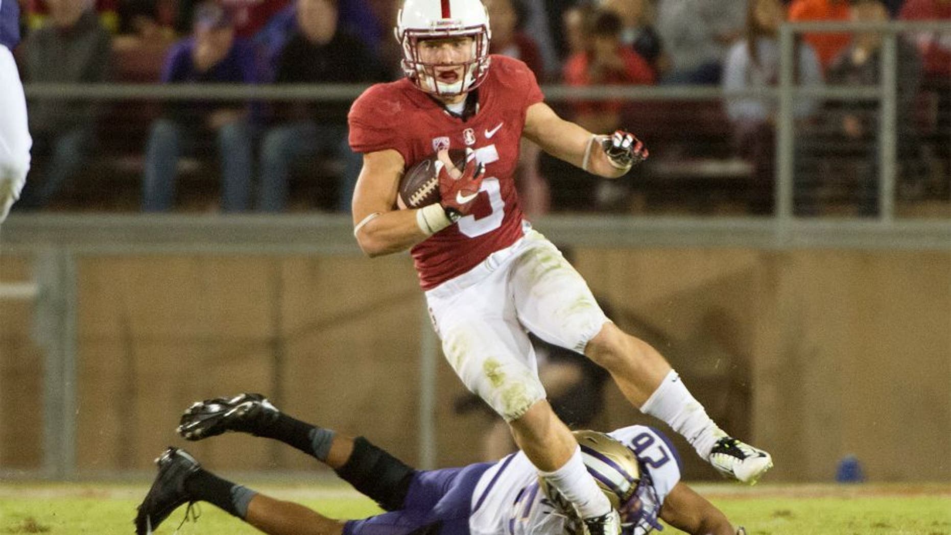 October 24, 2015; Stanford, CA, USA; Stanford Cardinal running back Christian McCaffrey (5) runs with the football against Washington Huskies defensive back Sidney Jones (26) during the third quarter at Stanford Stadium. The Cardinal defeated the Huskies 31-14. Mandatory Credit: Kyle Terada-USA TODAY Sports