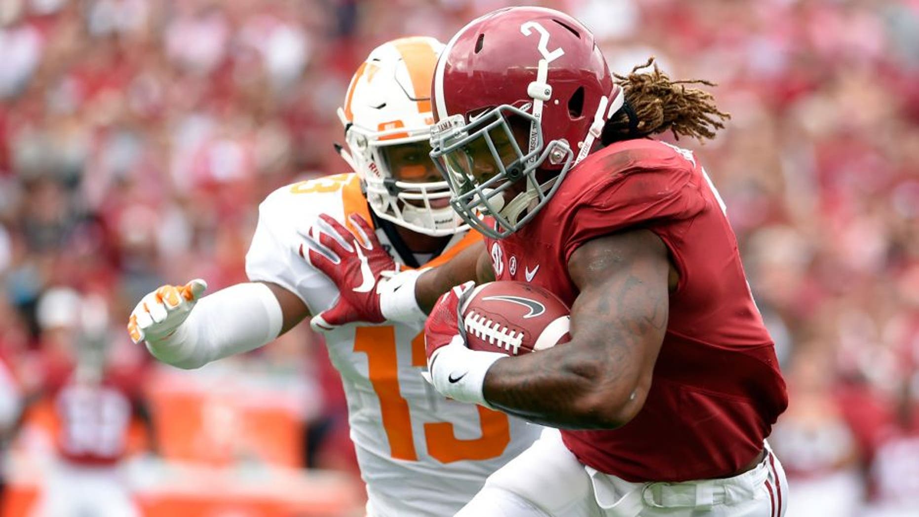 Oct 24, 2015; Tuscaloosa, AL, USA; Alabama Crimson Tide running back Derrick Henry (2) carries for a touchdown against Tennessee Volunteers defensive back Malik Foreman (13) during the first quarter at Bryant-Denny Stadium. Mandatory Credit: John David Mercer-USA TODAY Sports