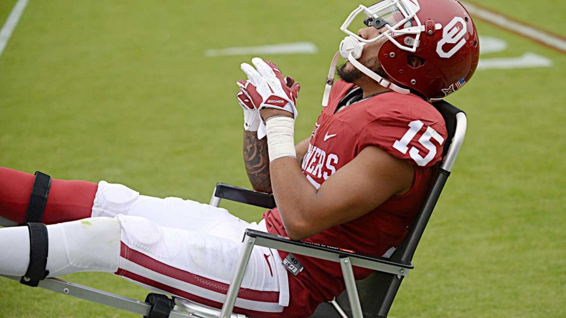 Oct 24, 2015; Norman, OK, USA; Oklahoma Sooners cornerback Zack Sanchez (15) is carted off of the field after being injured on the first play from scrimmage against the Texas Tech Red Raiders at Gaylord Family - Oklahoma Memorial Stadium. Mandatory Credit: Mark D. Smith-USA TODAY Sports