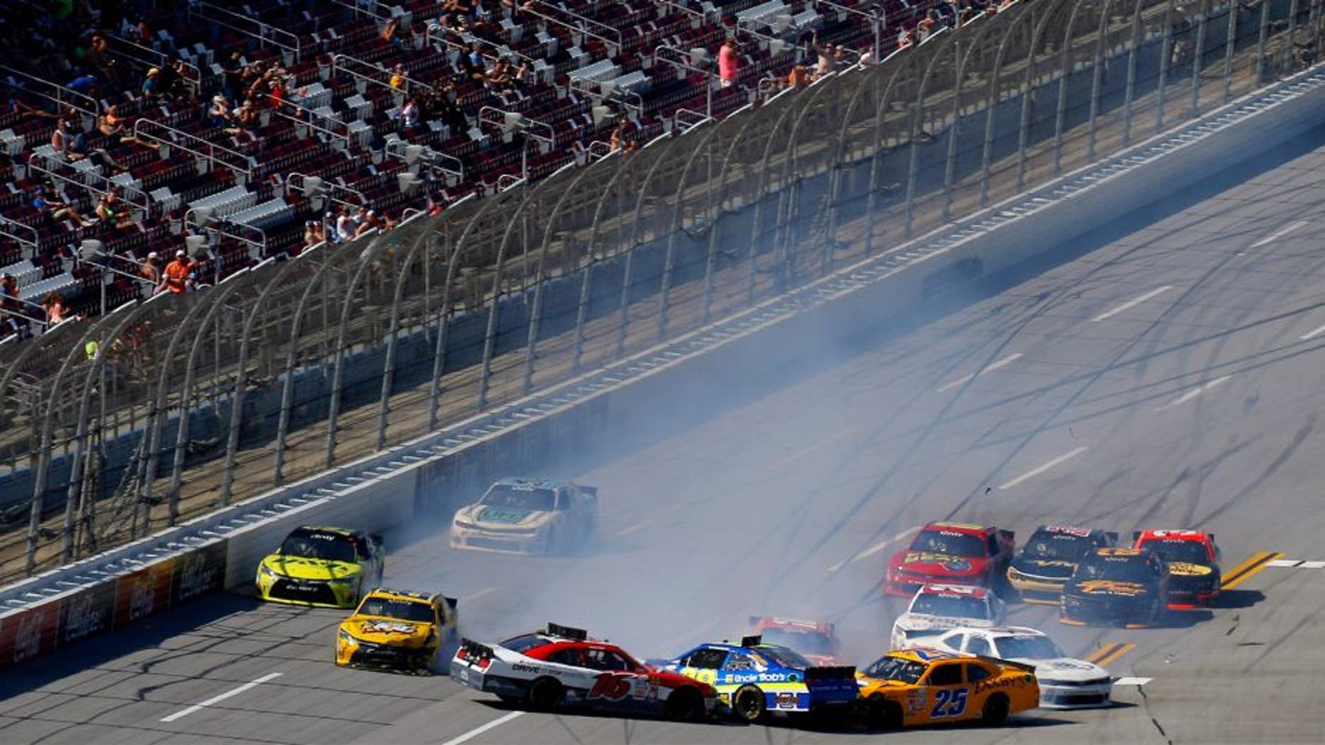 Ryan Reed, driver of the #16 Lilly/American Diabetes Association Ford, Ryan Sieg, driver of the #39 Uncle Bob's Self Storage Chevrolet, and John Wes Townley, driver of the #25 Zaxby's Chevrolet, wreck during the NASCAR XFINITY Series Winn Dixie 300 at Talladega Superspeedway on May 2, 2015 in Talladega, Alabama. (Photo by Jeff Zelevansky/NASCAR via Getty Images)