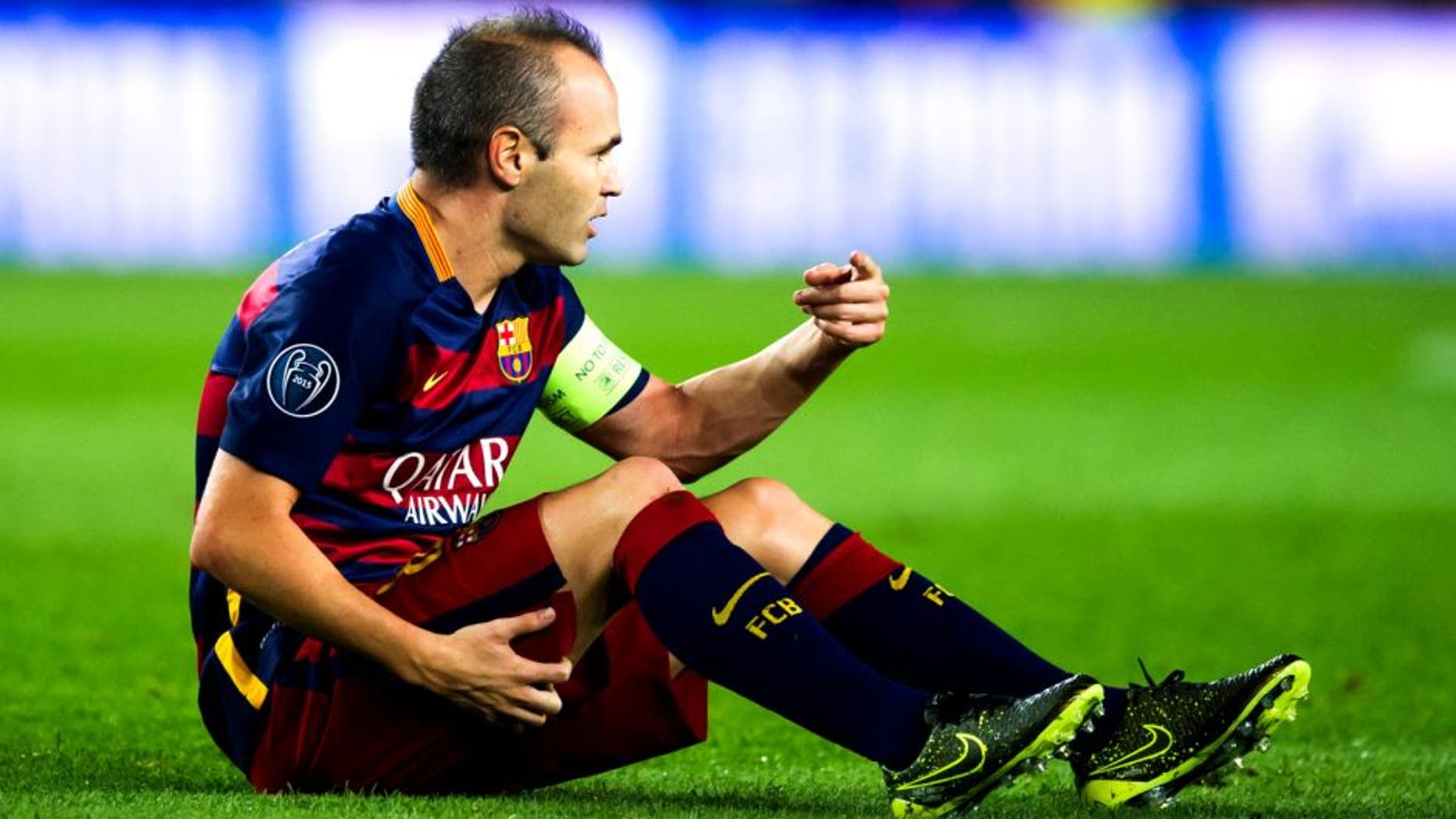 BARCELONA, SPAIN - SEPTEMBER 29: Andres Iniesta of FC Barcelona asks to his bench to be substituted as he lays injured during the UEFA Champions League Group E match between FC Barcelona and Bayern 04 Leverkusen at Camp Nou on September 29, 2015 in Barcelona, Spain. (Photo by Alex Caparros/Getty Images)