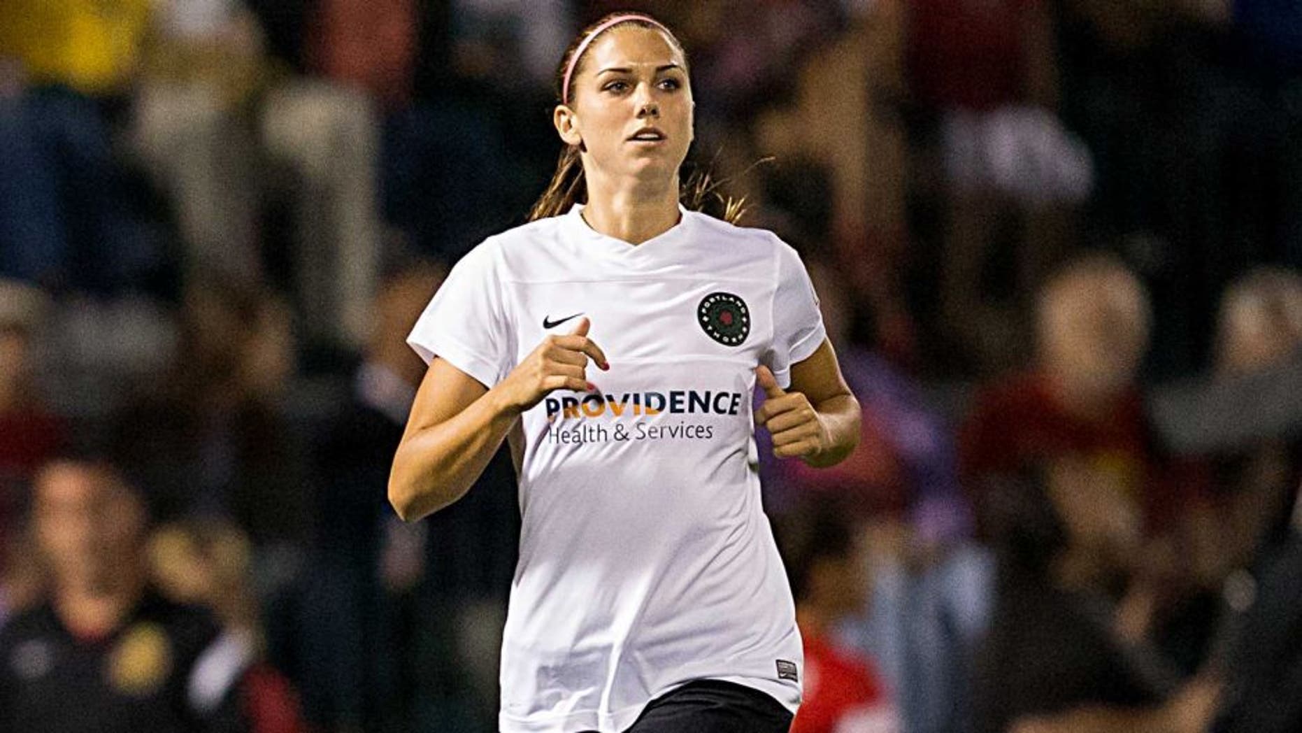 ROCHESTER, NY - AUGUST 31: Alex Morgan #13 of Portland Thorns FC enters the game against Western New York Flash during the second period despite a left knee injury in the National Women's Soccer League Championship at Sahlen's Stadium August 31, 2013 in Rochester, New York. (Photo by Brett Carlsen/Getty Images)