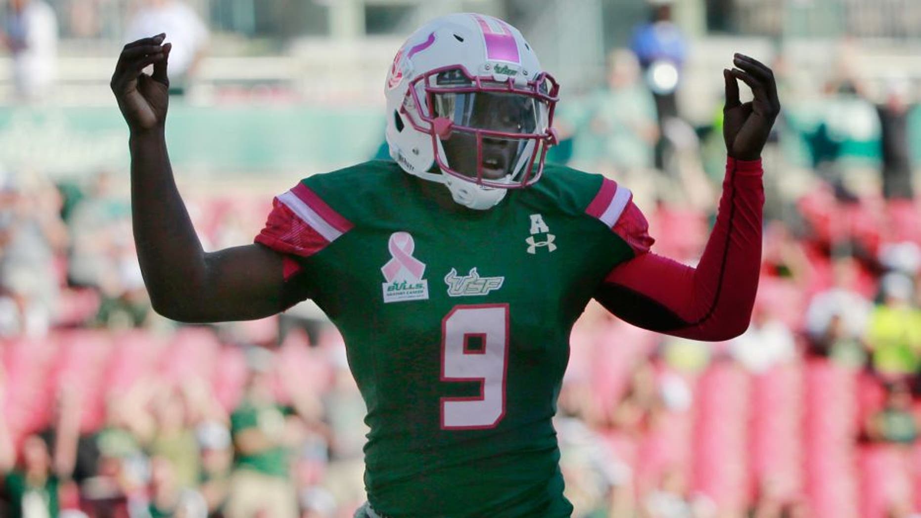 Oct 24, 2015; Tampa, FL, USA; South Florida Bulls quarterback Quinton Flowers (9) celebrates as he scores a touchdown against the Southern Methodist Mustangs during the first quarter at Raymond James Stadium. Mandatory Credit: Kim Klement-USA TODAY Sports