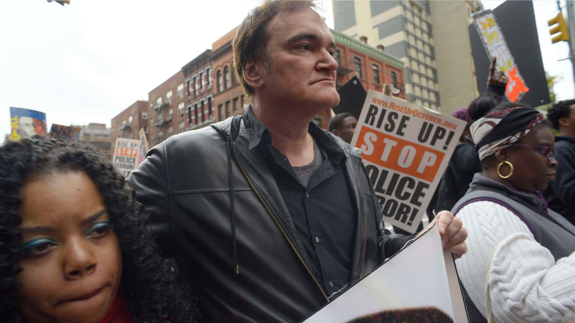 Oct. 24, 2015: Director Quentin Tarantino, center, participates in a rally to protest against police brutality in New York.