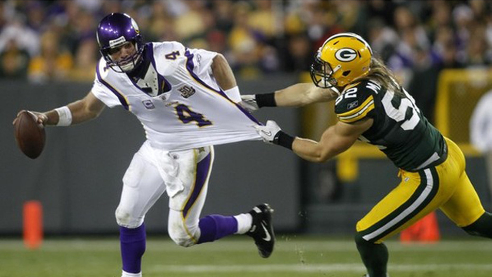 Oct. 24: Green Bay Packers linebacker Clay Matthews (52) attempts to tackle Minnesota Vikings quarterback Brett Favre (4) in the fourth quarter of their NFL football game at Lambeau Field Green Bay, Wisconsin.