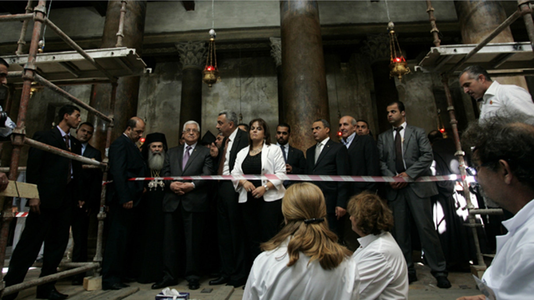 Oct. 25: Palestinian President Mahmoud Abbas, fourth left, stands with Greek Orthodox Patriarch of Jerusalem Theofilos III, third left, as they inspect restoration works at the Church of Nativity, traditionally believed by many to be the birthplace of Jesus Christ, in the West Bank town of Bethlehem.