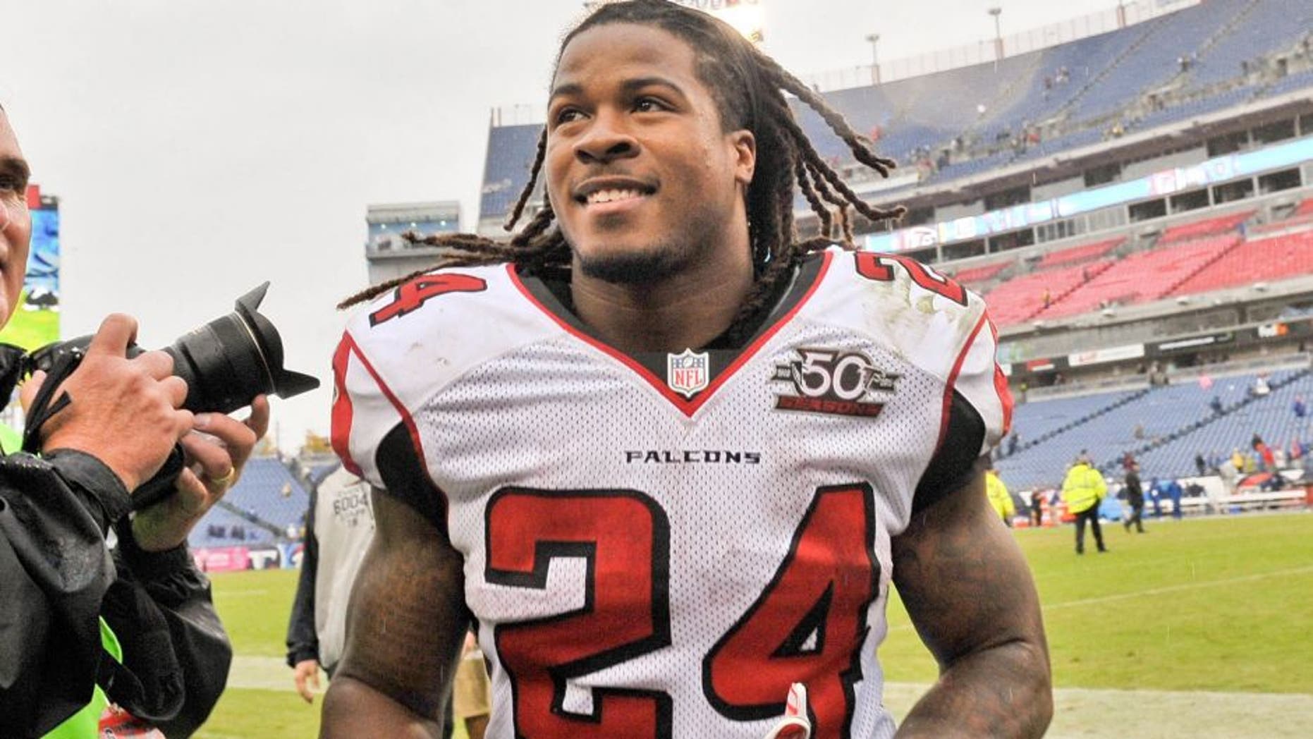 Oct 25, 2015; Nashville, TN, USA; Atlanta Falcons running back Devonta Freeman (24) runs off the field after defeating the Tennessee Titans during the second half at Nissan Stadium. Atlanta won 10-7. Mandatory Credit: Jim Brown-USA TODAY Sports