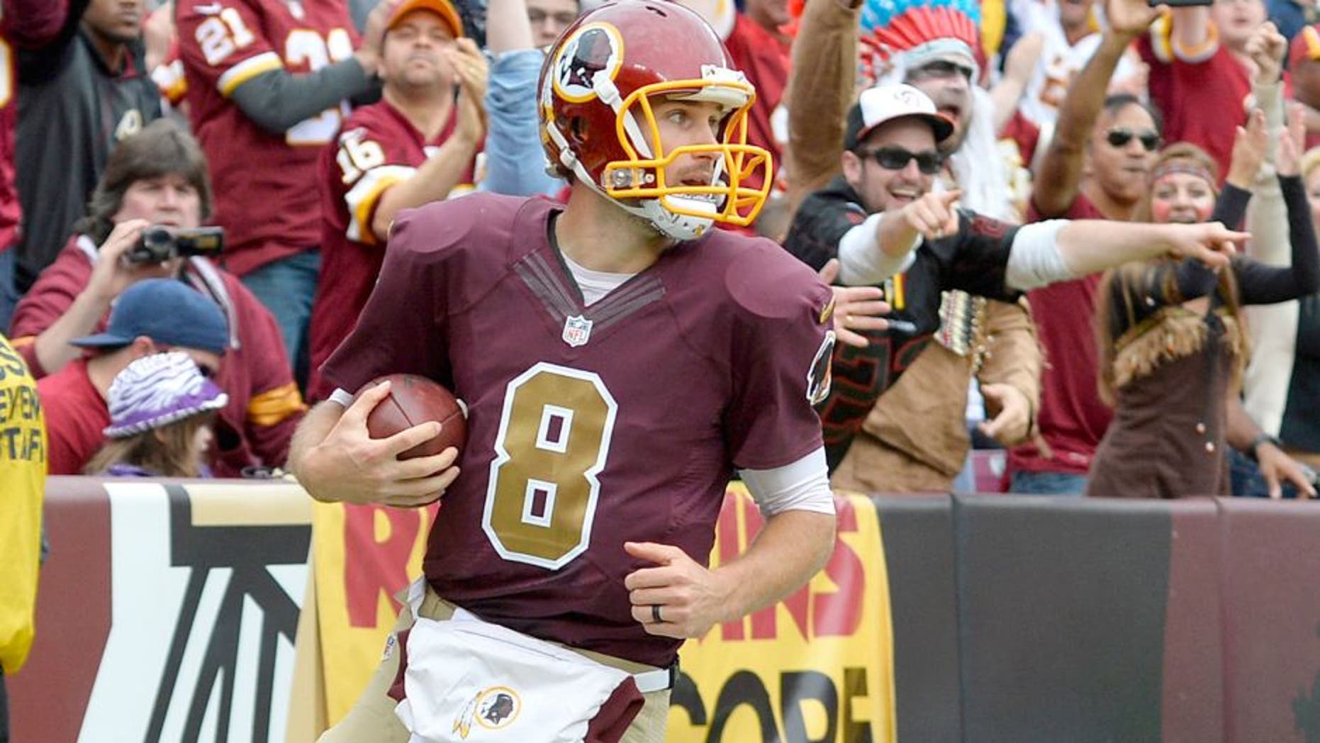 Oct 25, 2015; Landover, MD, USA; Washington Redskins quarterback Kirk Cousins (8) celebrates after scoring a running touchdown during the second quarter against the Tampa Bay Buccaneers at FedEx Field. Mandatory Credit: Tommy Gilligan-USA TODAY Sports