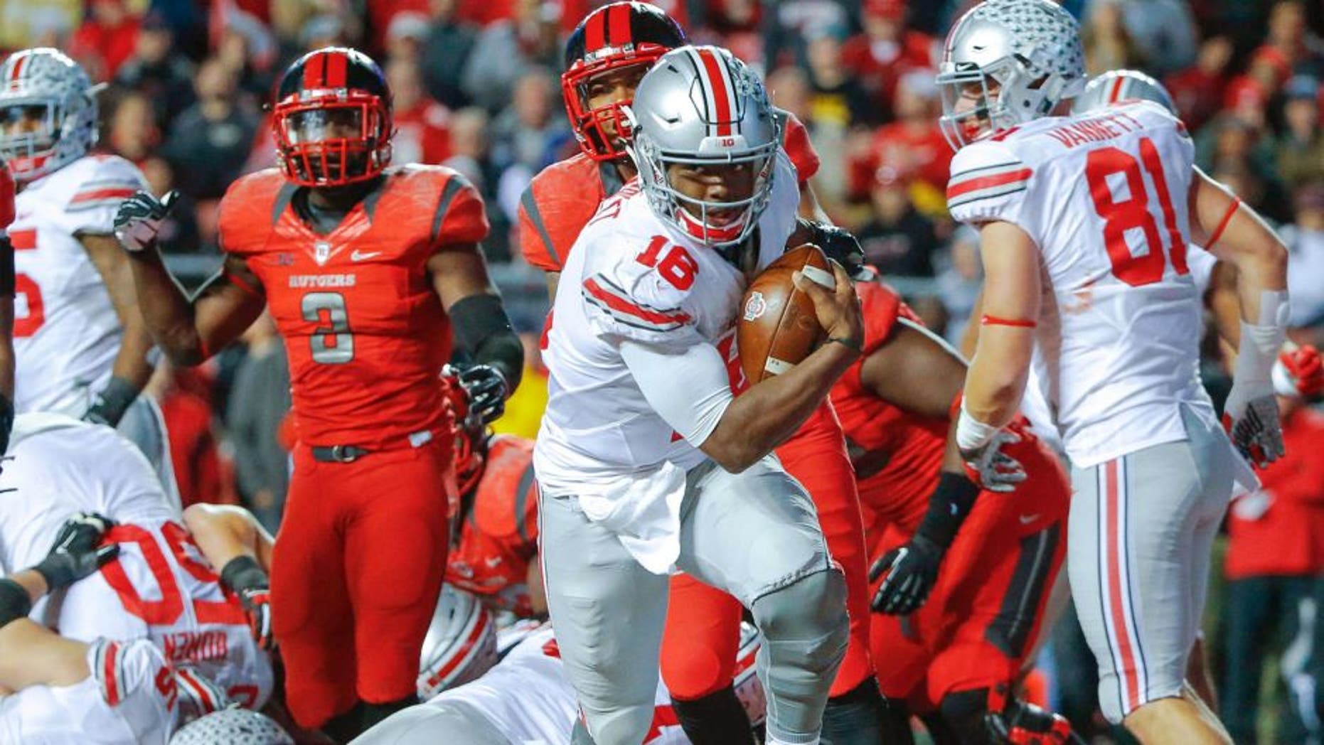 Oct 24, 2015; Piscataway, NJ, USA; Ohio State Buckeyes quarterback J.T. Barrett (16) crosses the goal line for second quarter touchdown against the Rutgers Scarlet Knights at High Points Solutions Stadium. Mandatory Credit: Jim O'Connor-USA TODAY Sports