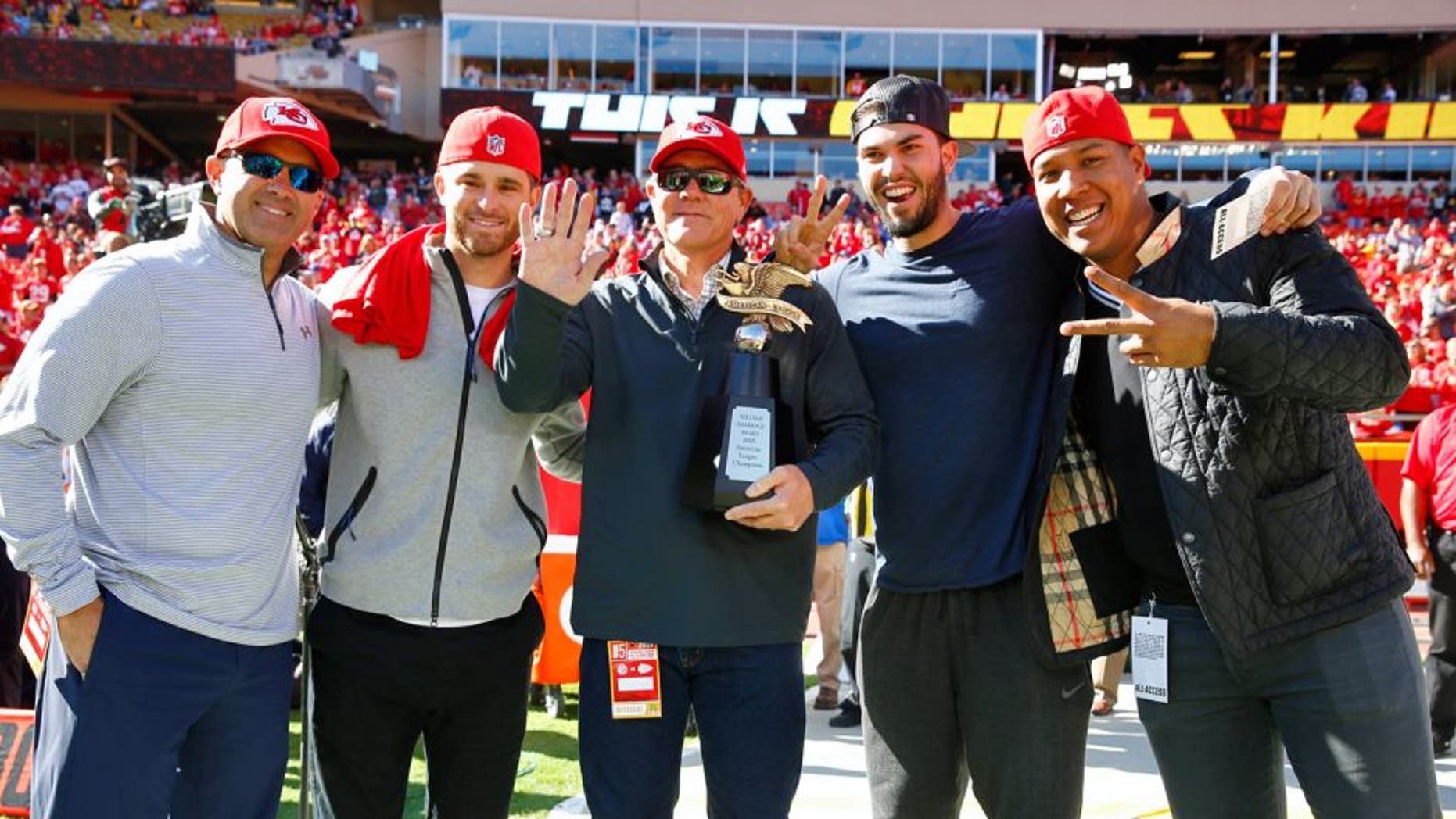 KANSAS CITY, MO - OCTOBER 25: Kansas City Royals Pedro Grifol, Drew Butera, Ned Yost, Eric Hosmer, and Salvador Perez are recognized with the American League Championship Trophy before the game between the Pittsburgh Steelers and the Kansas City Chiefs at Arrowhead Stadium on October 25, 2015 in Kansas City, Missouri. (Photo by Jamie Squire/Getty Images)