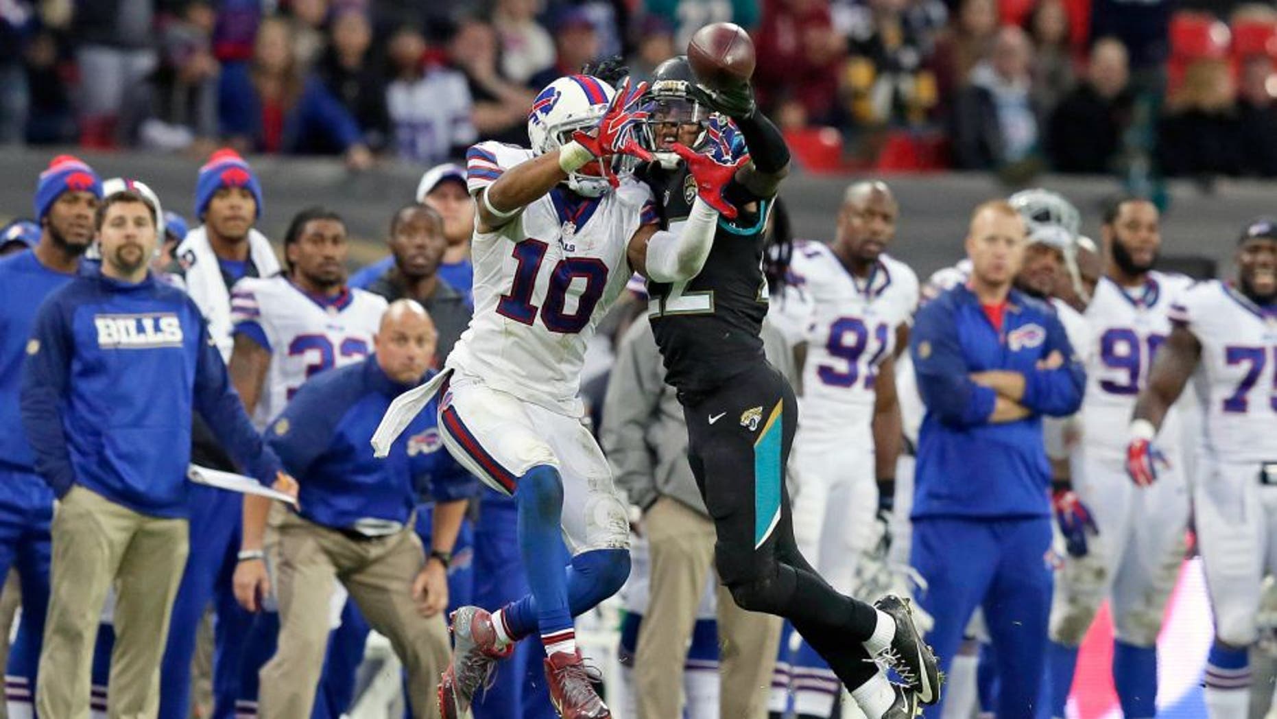Jacksonville Jaguars cornerback Aaron Colvin (22), right, prevents Buffalo Bills wide receiver Robert Woods (10) from catching the ball during the NFL game between Buffalo Bills and Jacksonville Jaguars at Wembley Stadium in London, Sunday, Oct. 25, 2015. (AP Photo/Tim Ireland)