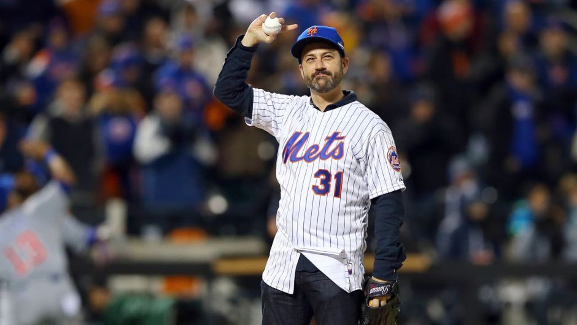 NEW YORK, NY - OCTOBER 18: Television host Jimmy Kimmel waves to the crowd prior to his first pitch before game two of the 2015 MLB National League Championship Series between the Chicago Cubs and the New York Mets at Citi Field on October 18, 2015 in the Flushing neighborhood of the Queens borough of New York City. (Photo by Elsa/Getty Images)