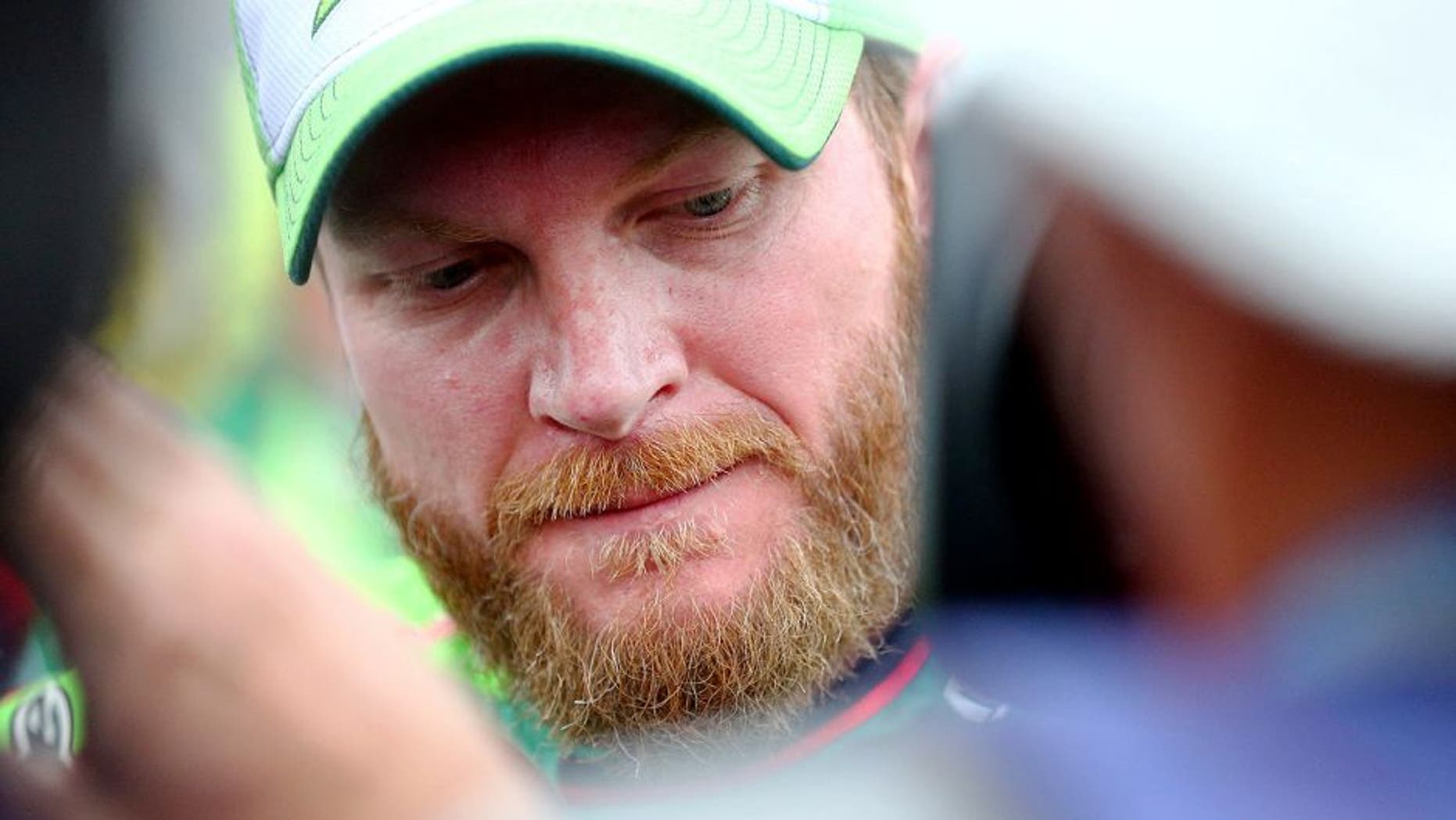 TALLADEGA, AL - OCTOBER 25: Dale Earnhardt Jr., driver of the #88 Diet Mountain Dew Chevrolet, looks on after the NASCAR Sprint Cup Series CampingWorld.com 500 at Talladega Superspeedway on October 25, 2015 in Talladega, Alabama. (Photo by Sarah Crabill/Getty Images)