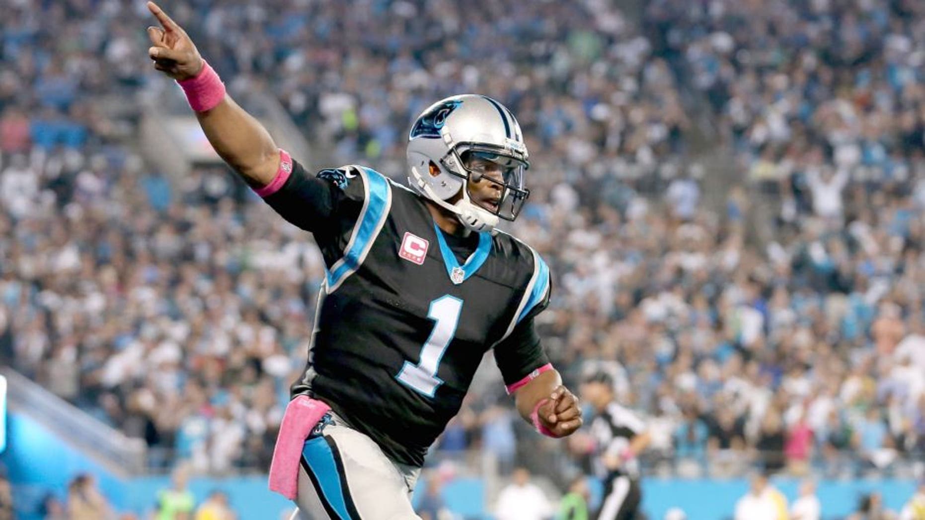 CHARLOTTE, NC - OCTOBER 25: Cam Newton #1 of the Carolina Panthers salutes the crowd after their first touchdown against the Philadelphia Eagles at Bank of America Stadium on October 25, 2015 in Charlotte, North Carolina. (Photo by Streeter Lecka/Getty Images)