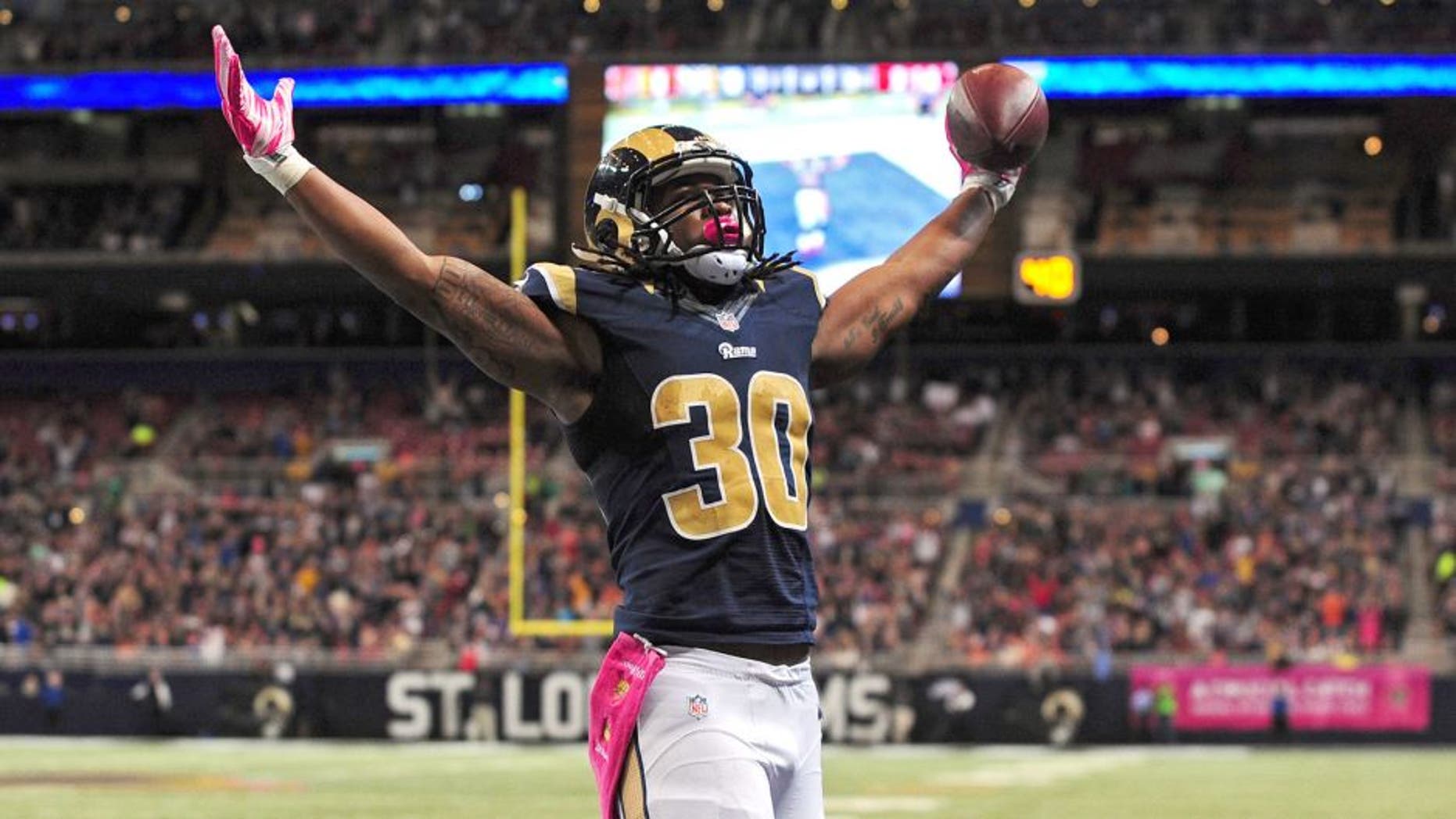 Oct 25, 2015; St. Louis, MO, USA; St. Louis Rams running back Todd Gurley (30) celebrates after scoring a one yard touchdown against the Cleveland Browns during the second half at the Edward Jones Dome. St. Louis defeated Cleveland 24-6. Mandatory Credit: Jeff Curry-USA TODAY Sports