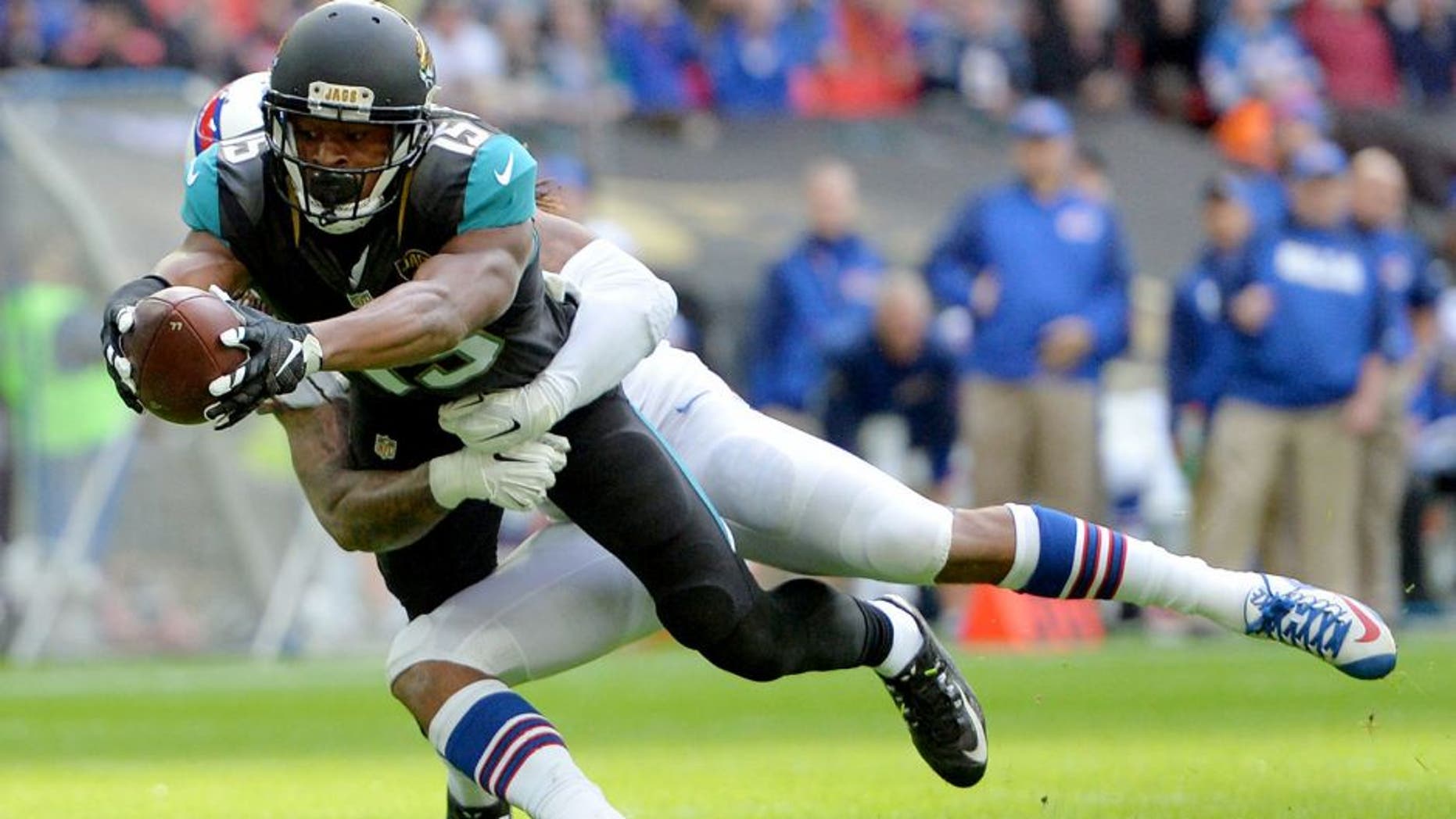 Oct 25, 2015; London, United Kingdom; Jacksonville Jaguars receiver Allen Robinson (15) is defended by Buffalo Bills cornerback Stephon Gilmore (24) on a 10-yard touchdown reception in the first quarter during NFL International Series game at Wembley Stadium. Mandatory Credit: Kirby Lee-USA TODAY Sports