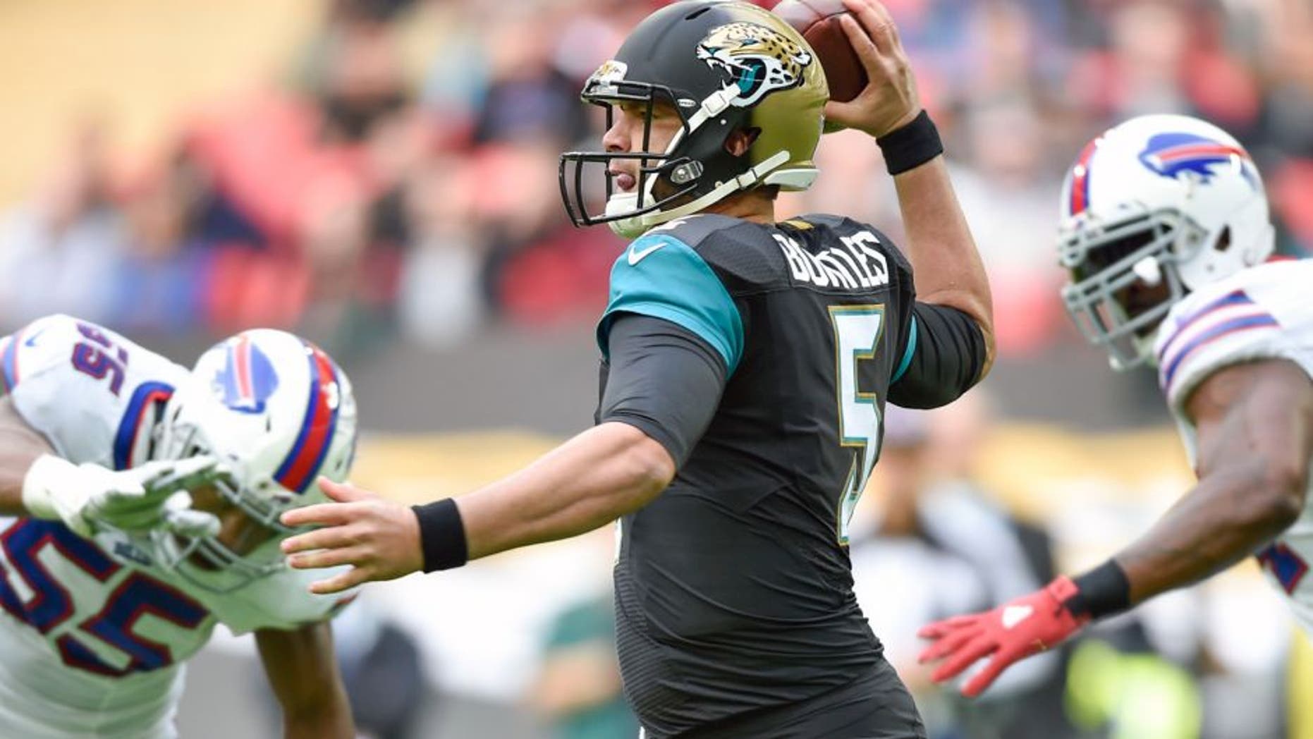 Oct 25, 2015; London, United Kingdom; Jacksonville Jaguars quarterback Blake Bortles (5) runs as he looks for a pass down field during the first half of the game Jacksonville Jaguars and the Buffalo Bills at Wembley Stadium. Mandatory Credit: Steve Flynn-USA TODAY Sports
