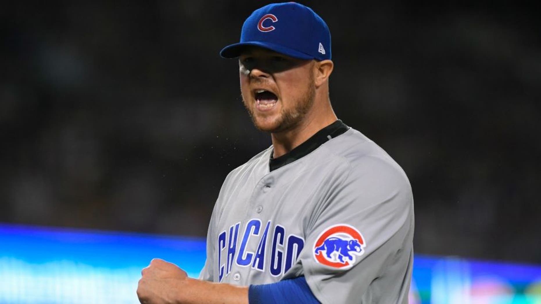 Chicago Cubs starting pitcher Jon Lester reacts after getting out of the seventh inning of Game 5 of the National League baseball championship series against the Los Angeles Dodgers Thursday, Oct. 20, 2016, in Los Angeles. (AP Photo/Mark J. Terrill)