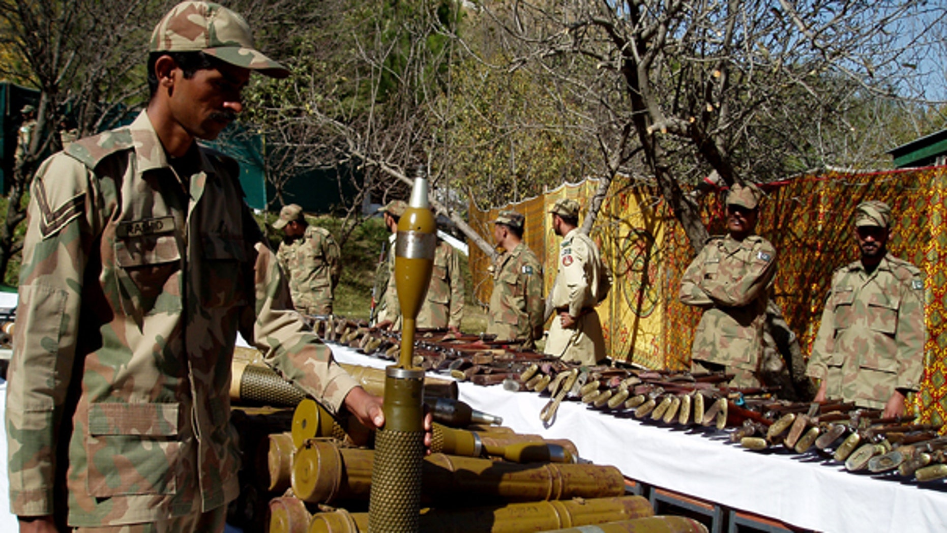 Oct. 26: Pakistan army soldiers stand near confiscated arms and ammunition during operations against militants in Kalaya in Pakistan's tribal area of Orakzai near the Afghanistan border.