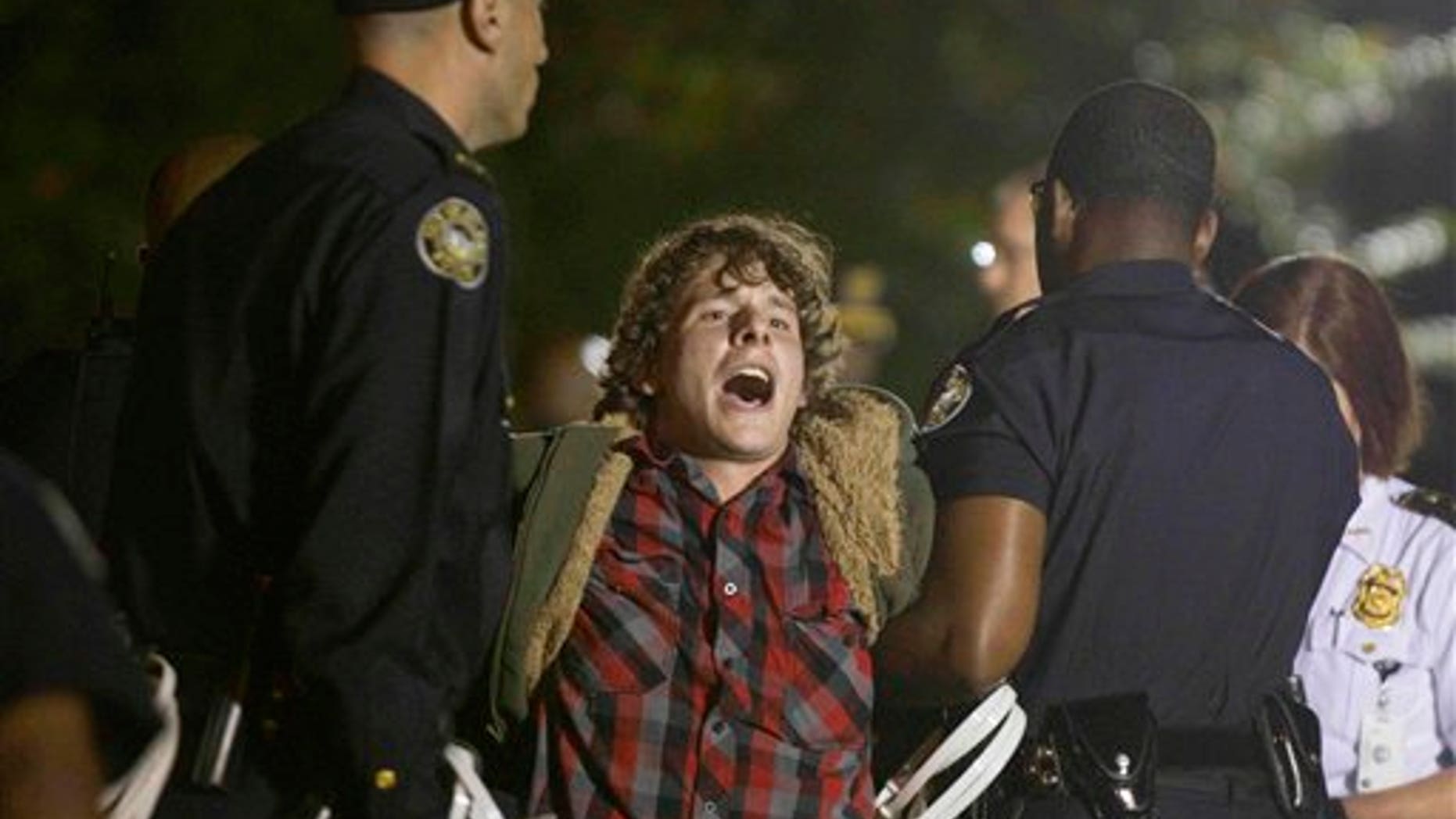 October 26, 2011: A protestor of the Occupy Atlanta demonstration is arrested after refusing to leave their camp after Mayor Kasim Reed revoked his executive order allowing the protestors to camp out in Woodruff Park.