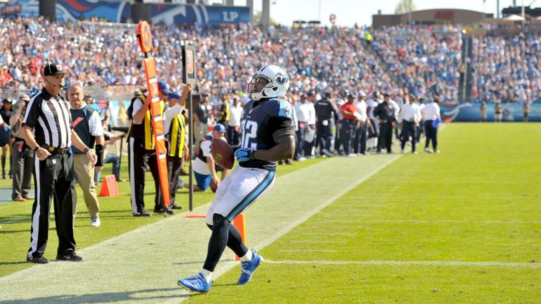 Oct 26, 2014; Nashville, TN, USA; Tennessee Titans tight end Delanie Walker (82) catches a pass and rushes for a touchdown against the Houston Texans during the second half at LP Field. Texans won 30-16. Mandatory Credit: Jim Brown-USA TODAY Sports